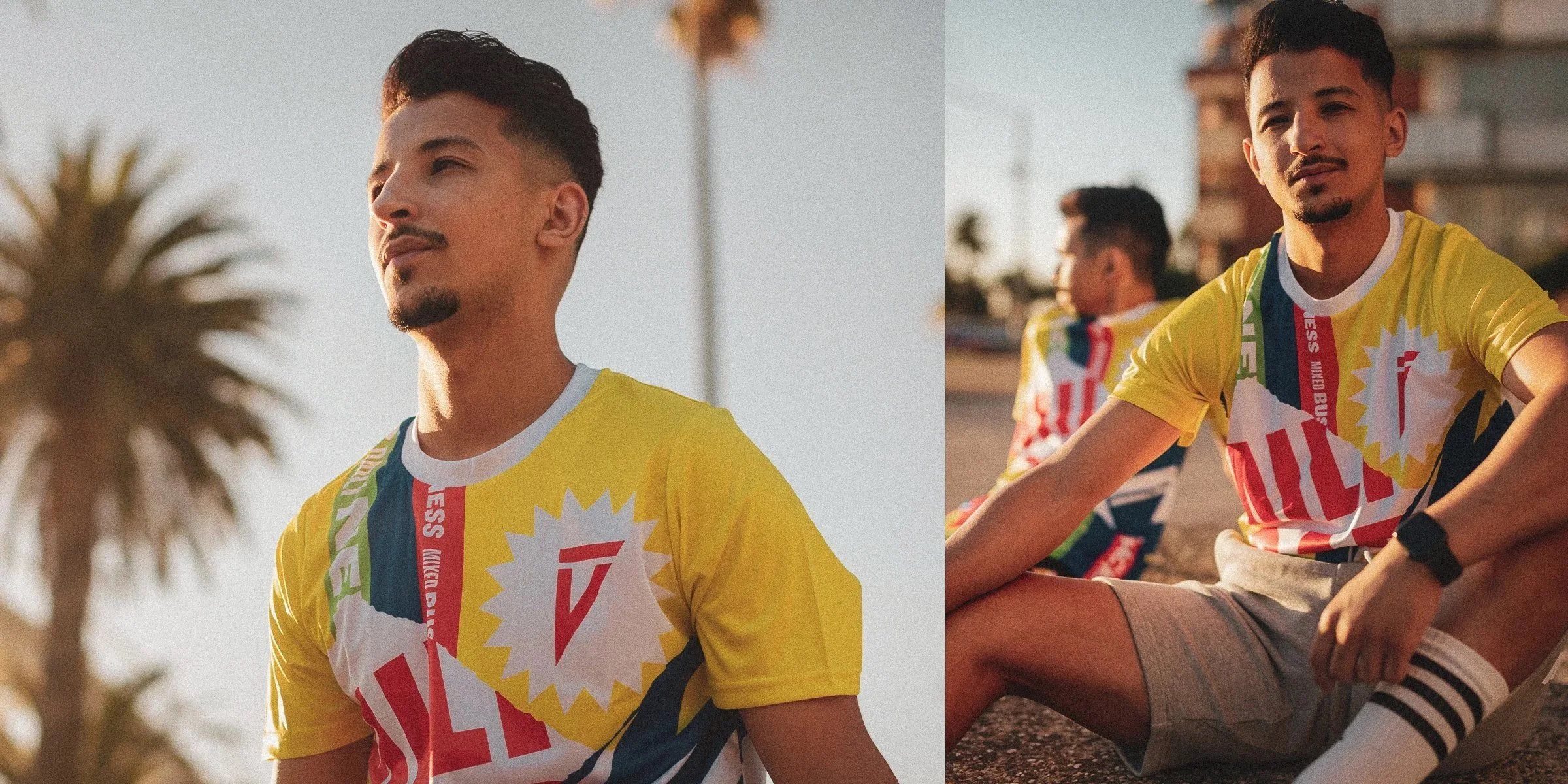 Young man with short dark hair and a goatee, wearing a colorful patterned T-shirt, sitting outdoors during sunset.