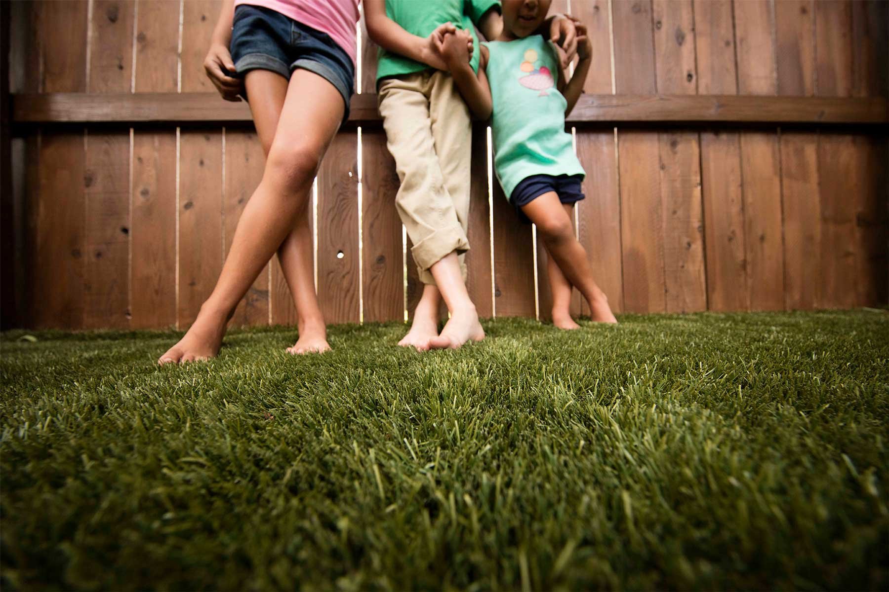 envirofill-kids-by-fence-on-artificial-grass.jpg