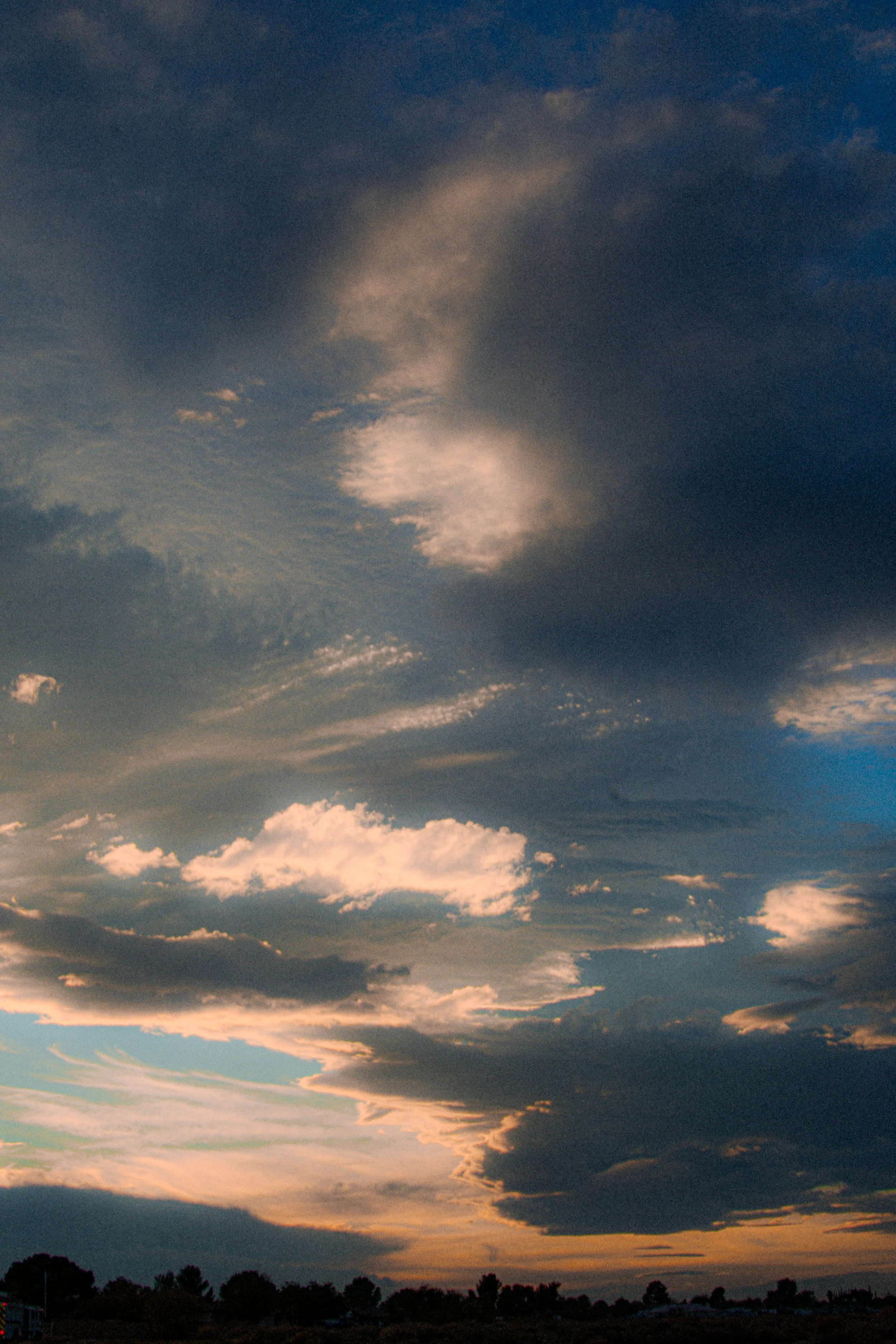 Sky with scattered clouds during sunset or sunrise.