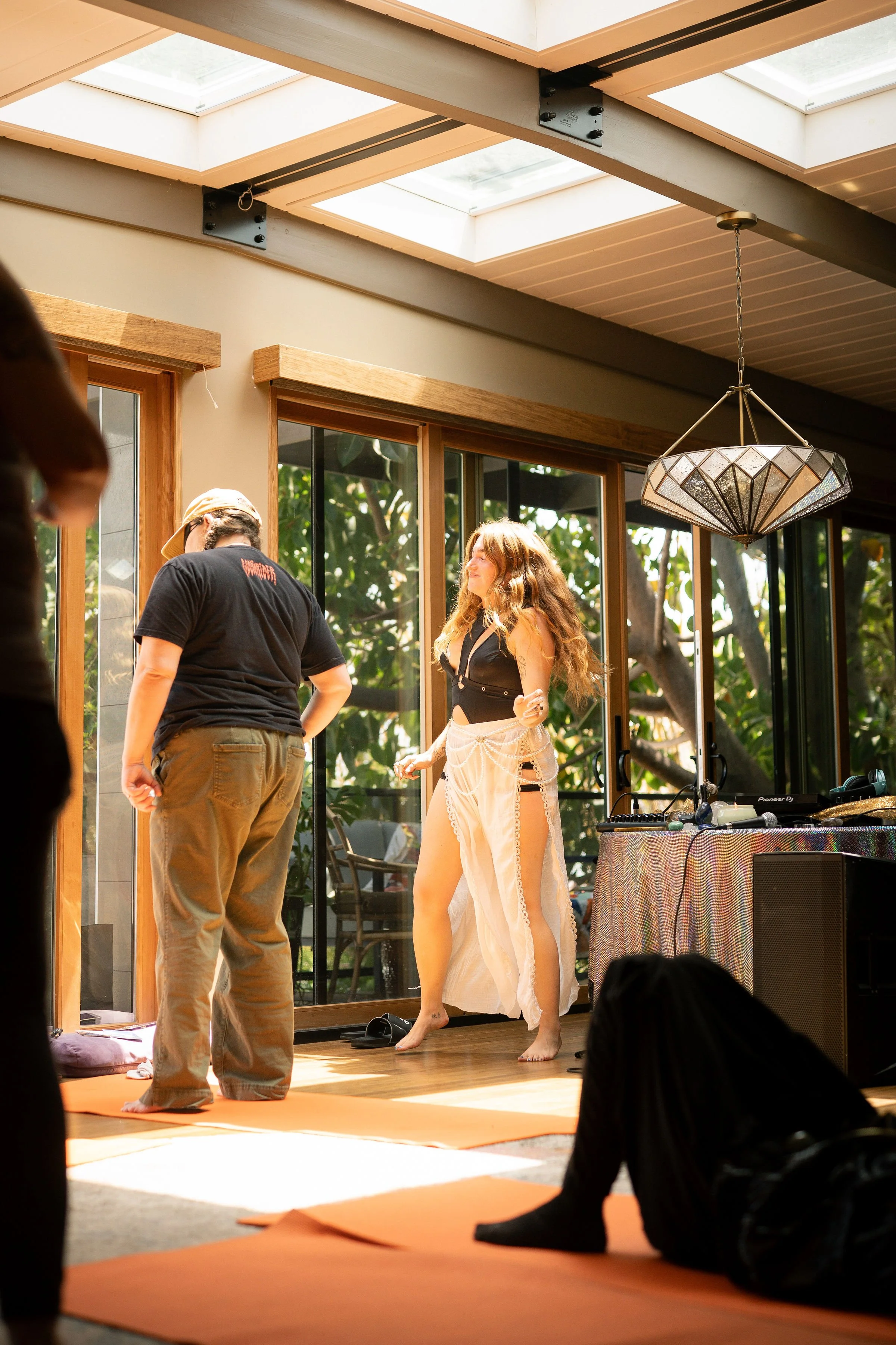 edm meditation, dance meditation, woman leading a dance meditation in san diego with eyes closed.