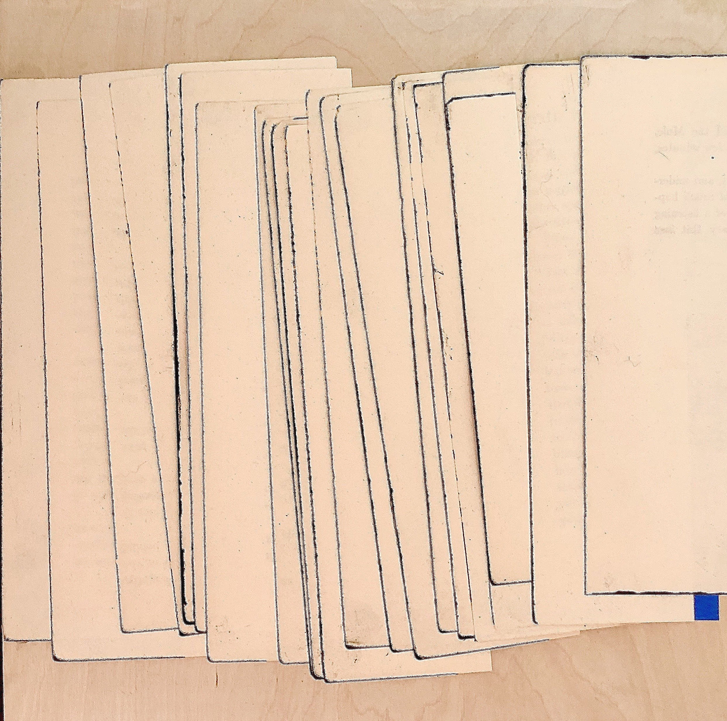 Open books laid out on a table, with their pages fanned out.