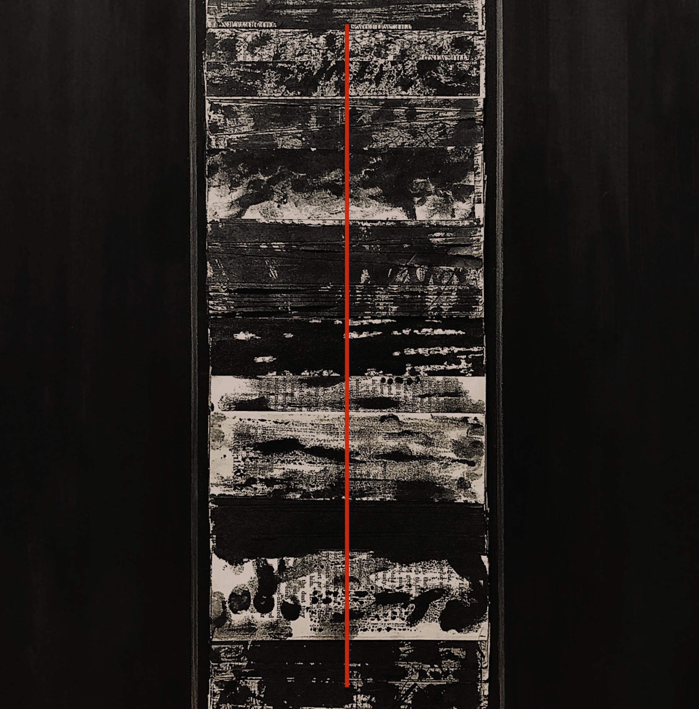 Vertical row of abstract black and white paint splatters on a rectangular canvas.