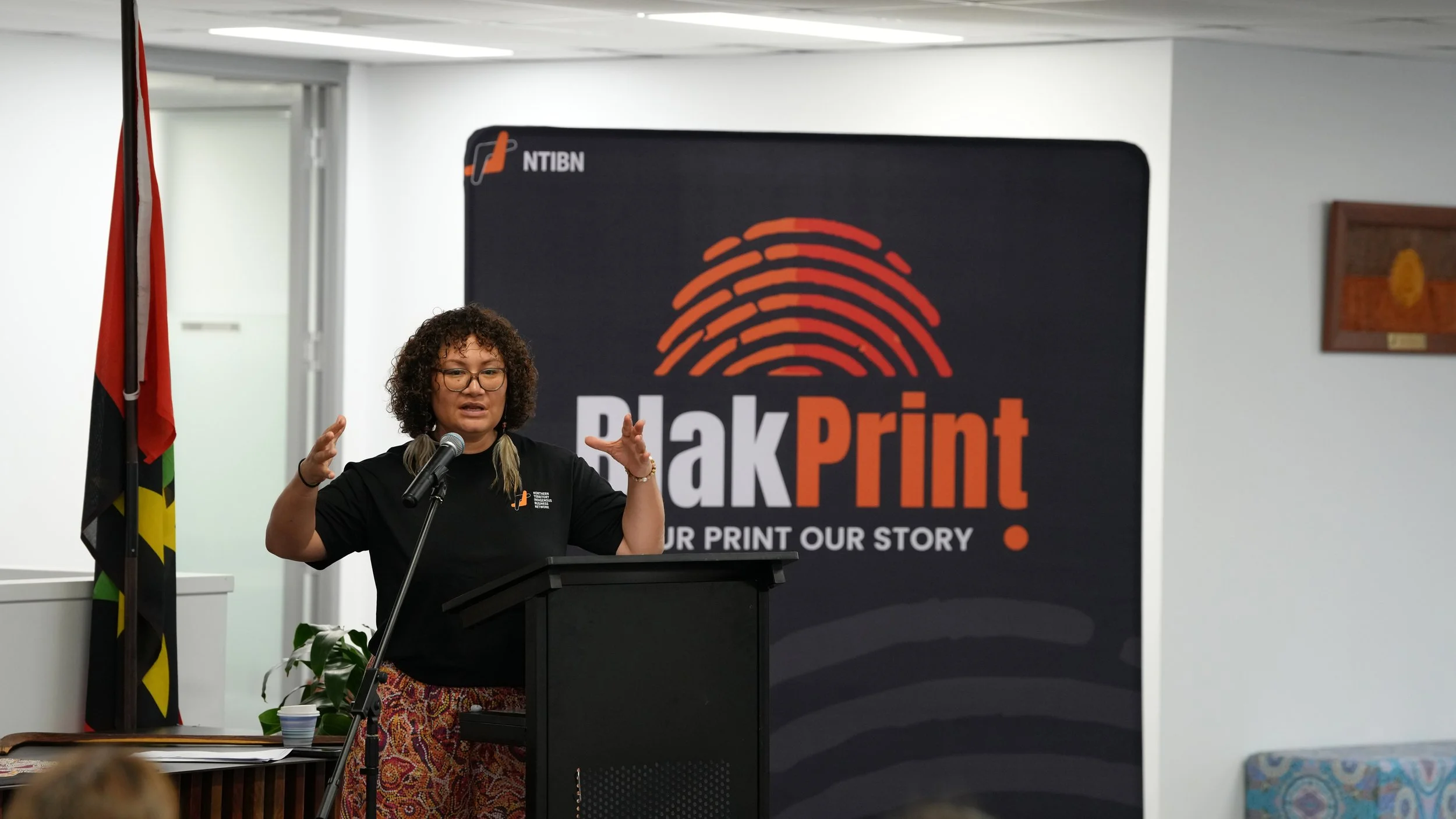 Naomi Anstess speaking at the launch of the BlakPrint report. Image: NTIBN.