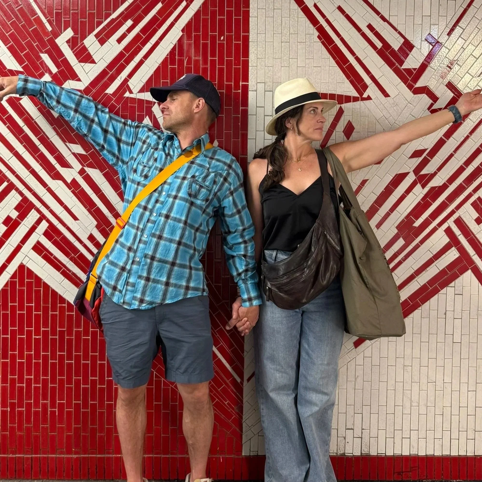 Jessica Sell Chambers standing in paris metro station with husband Reed
