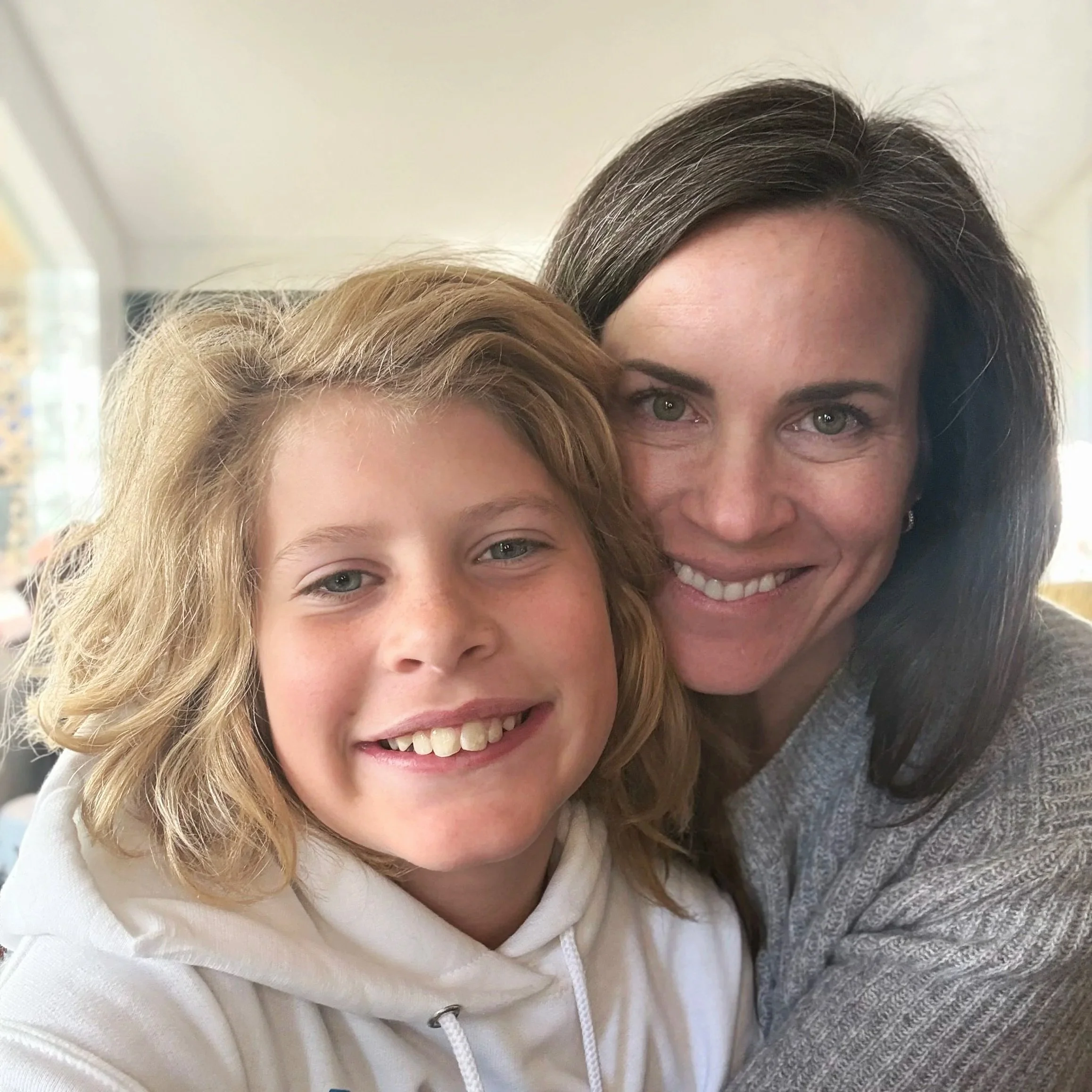 jessica Sell Chambers sitting with her son on her lap