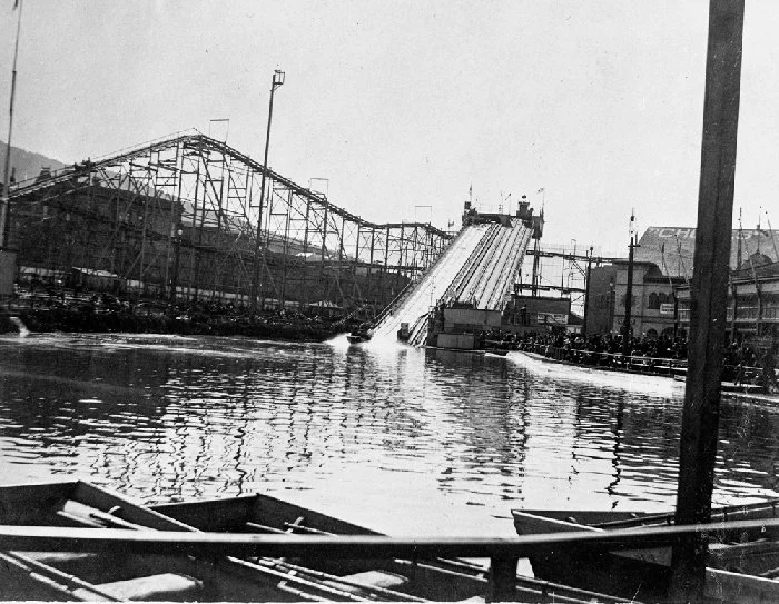 The long wooden chute ramp and the elevated Scenic Railway track curving behind the lake, around 1896.