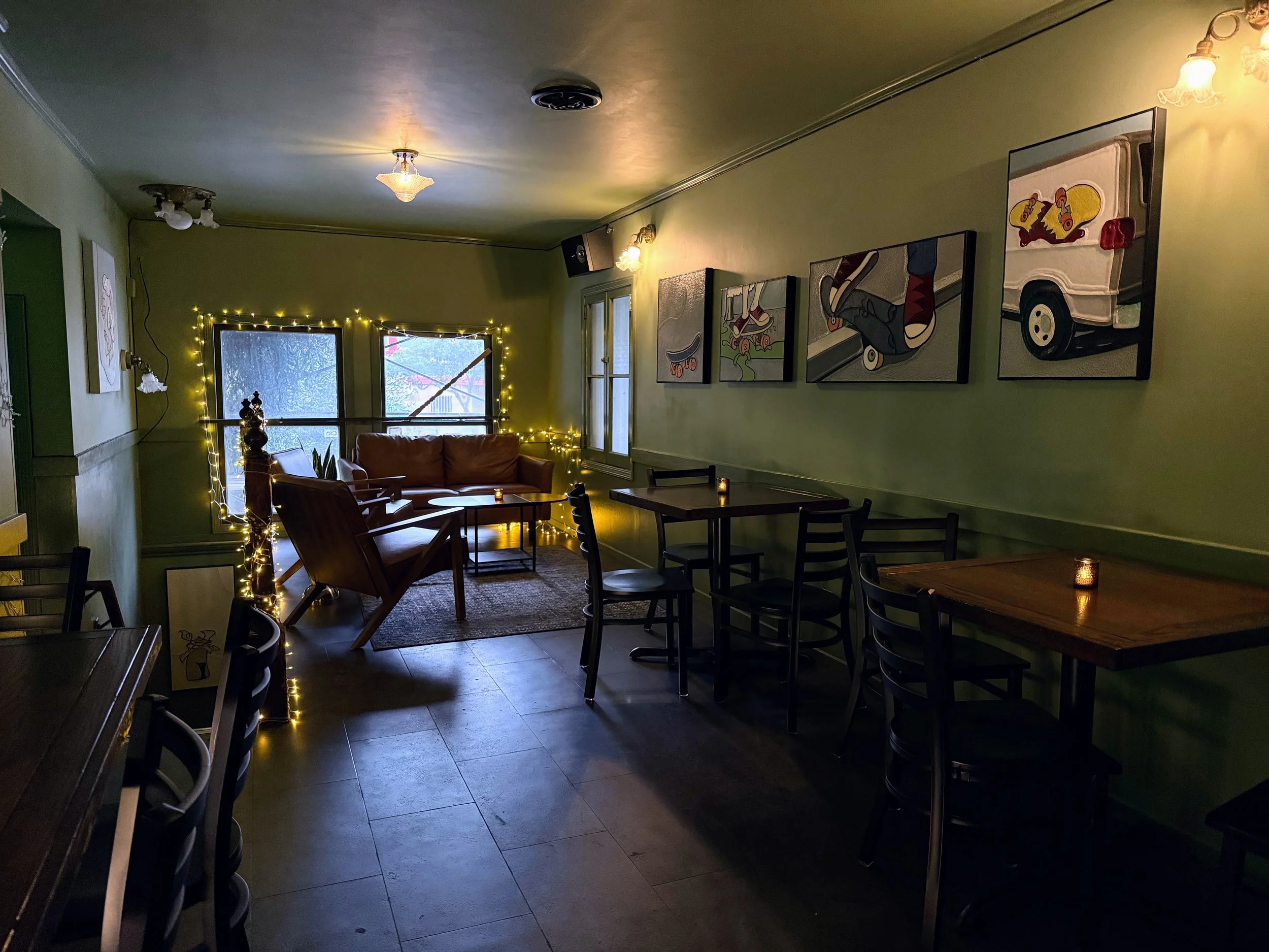 upstairs lounge area for a more intimate setting. tea candles on the tables and a comfortable couch.