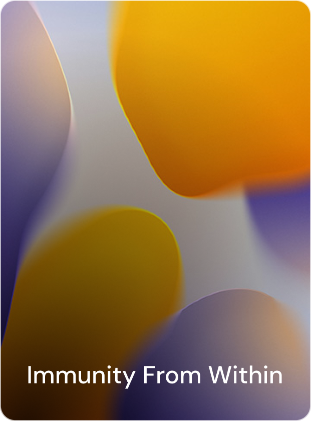 A person rowing a boat on a calm, blue lake surrounded by green mountains under a partly cloudy sky.