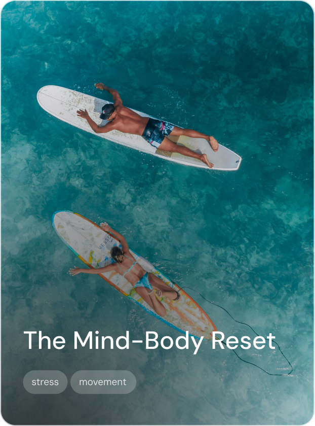 A man and a woman are lying on paddleboards in clear blue water, practicing relaxation or yoga, with the caption 'The Mind-body reset' and tags 'stress' and 'movement.'
