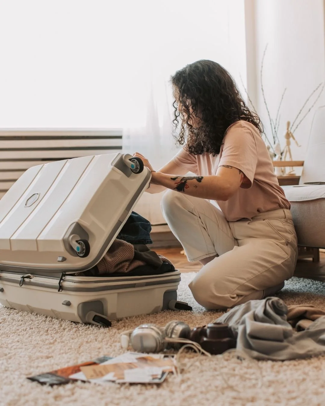 Parent feeling overwhelmed while packing suitcases for family vacationIMAGE 2 - Window of Tolerance Diagram Window of tolerance diagram showing hyperarousal, optimal window, and hypoarousal zones