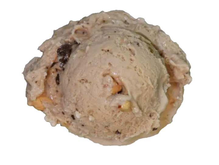 A scoop of cookies and cream ice cream with chocolate chunks in a waffle cone