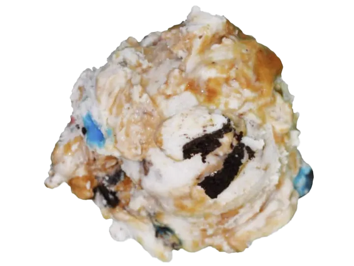 A scoop of cookies and cream ice cream with cookie pieces and caramel swirls