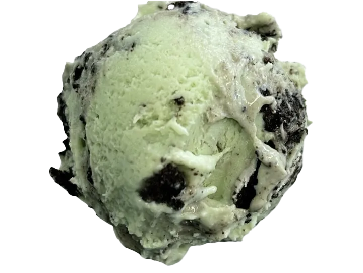 A scoop of cookies and cream ice cream with chocolate cookie pieces.