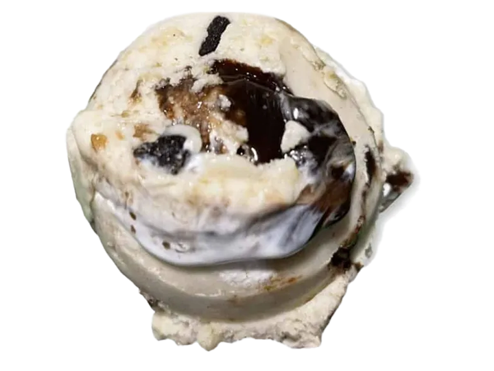 Close-up of a melting ice cream scoop with chocolate syrup on a black background.