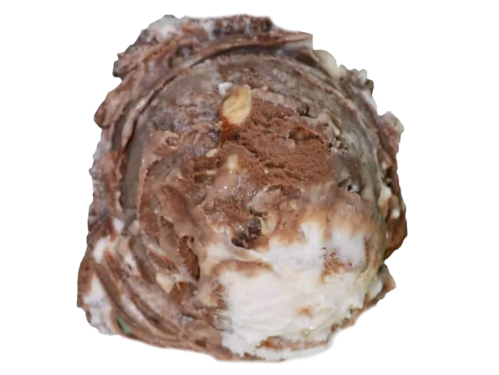 A close-up of a chocolate ice cream scoop with swirls of chocolate and white ice cream, sprinkled with small nuts.