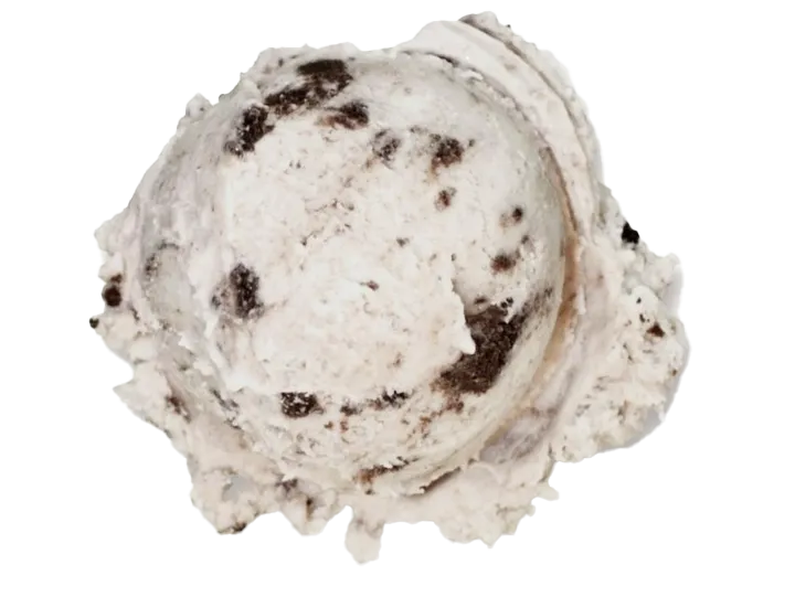 A scoop of cookies and cream ice cream with chocolate cookie chunks.