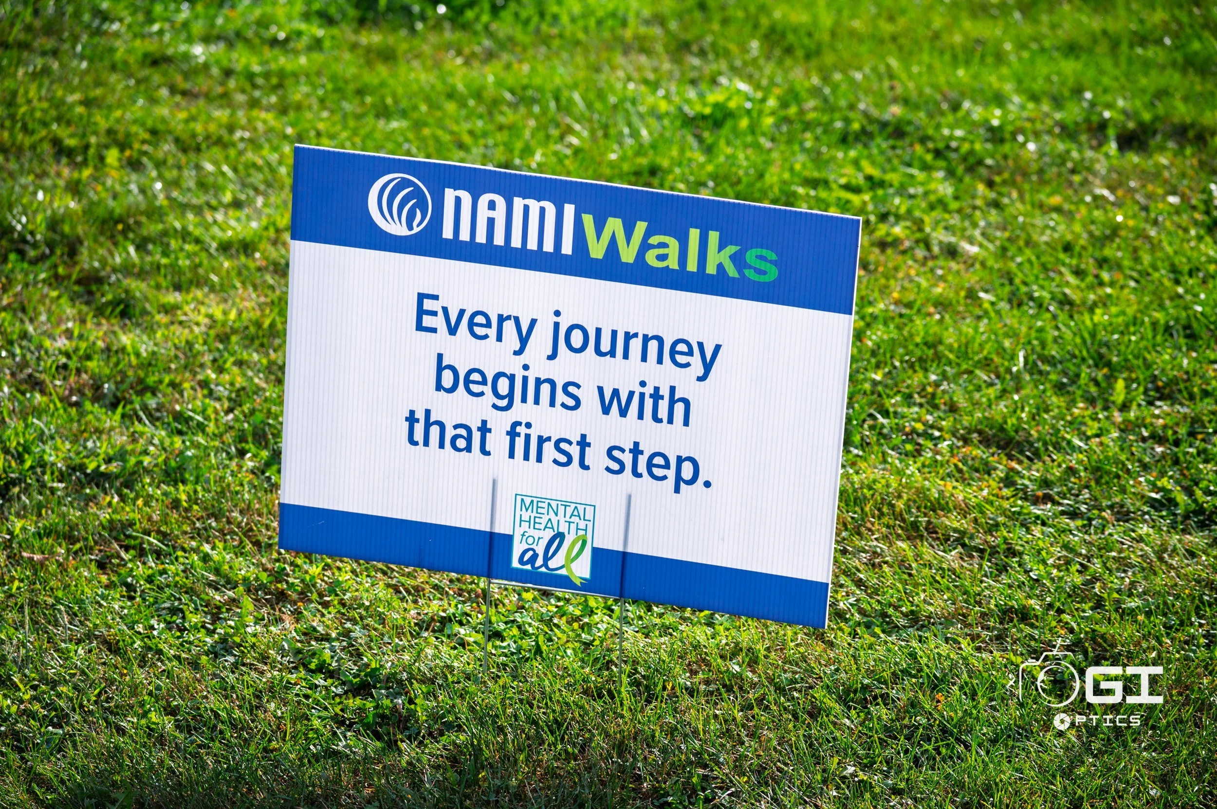 NAMIWalks yard sign reading Every journey begins with that first step at St. James Farm in Warrenville, IL