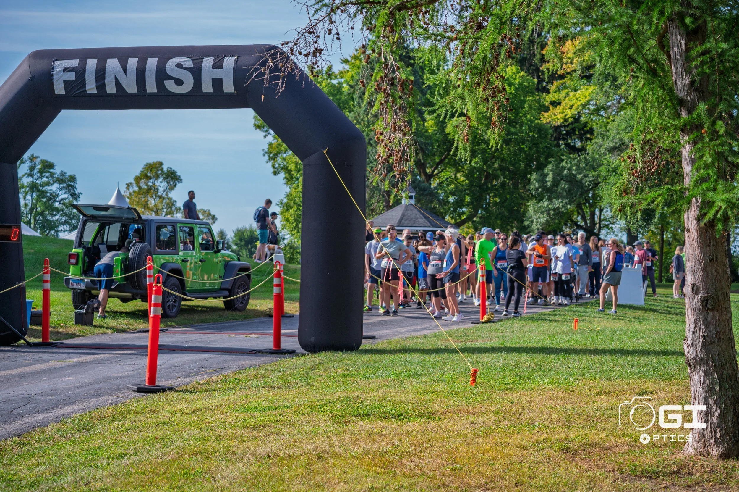 Walkers approaching the FINISH arch at NAMIWalks DuPage 2026 in Warrenville, IL