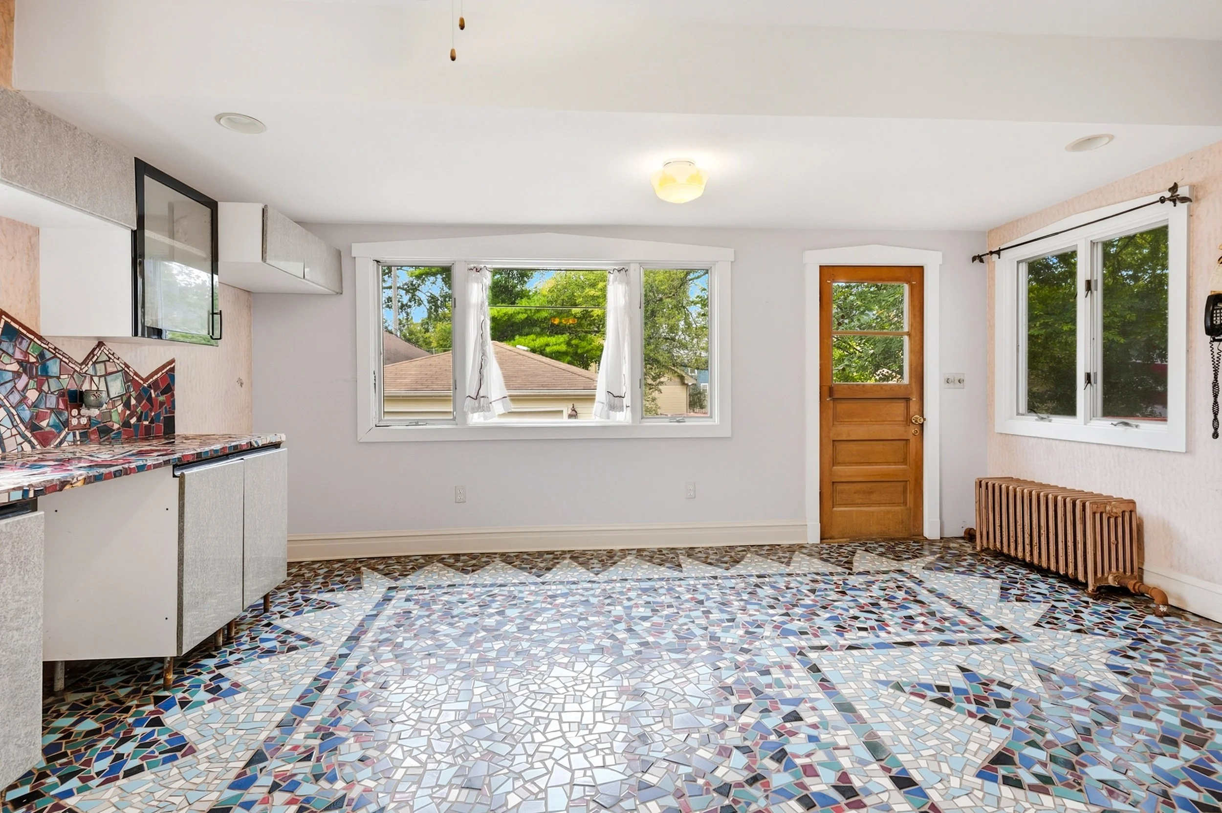 riverside-mosaic-tile-floor-toward-corner-windows.jpg