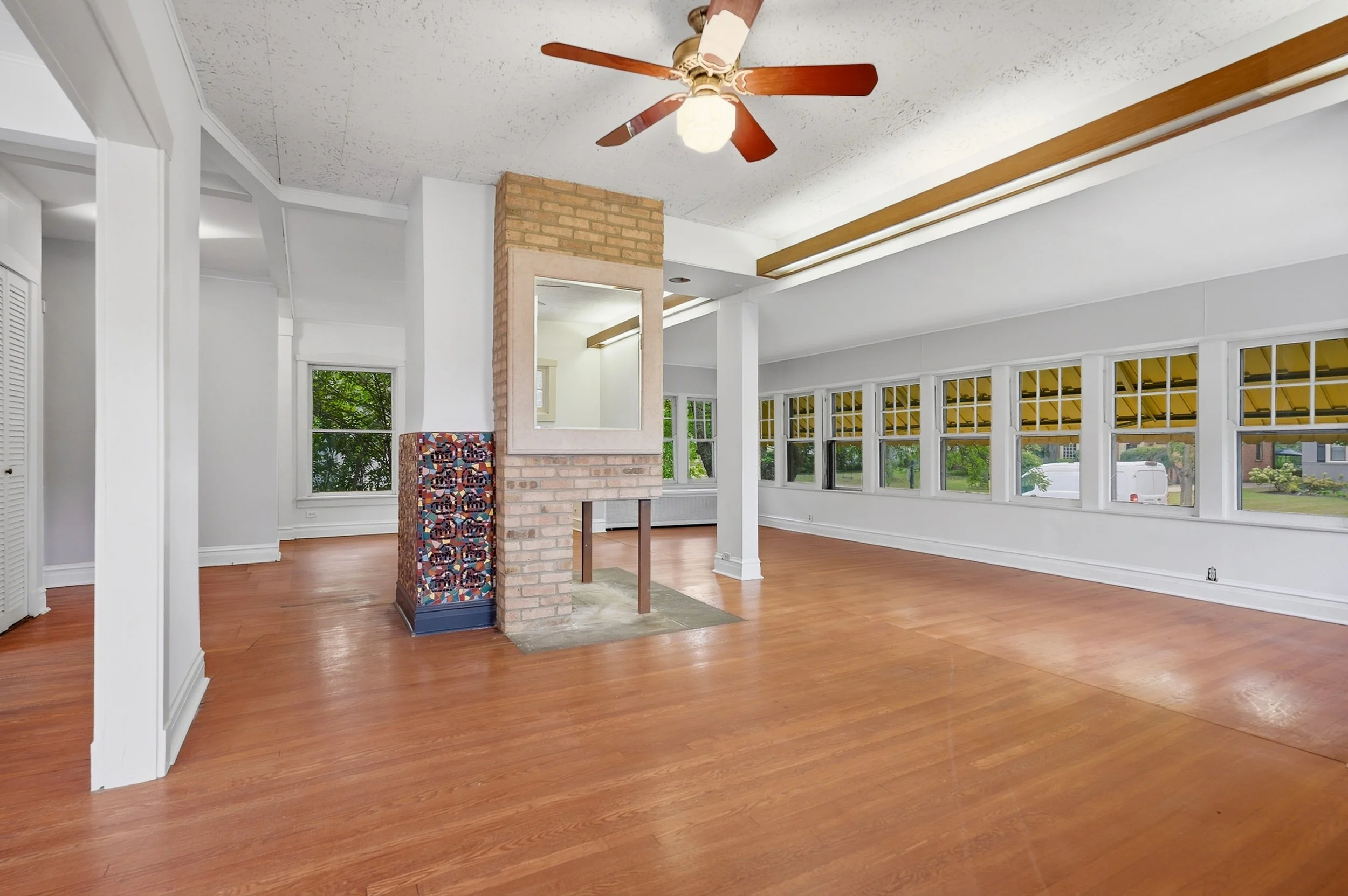riverside-living-and-dining-room-two-sided-brick-fireplace.jpg