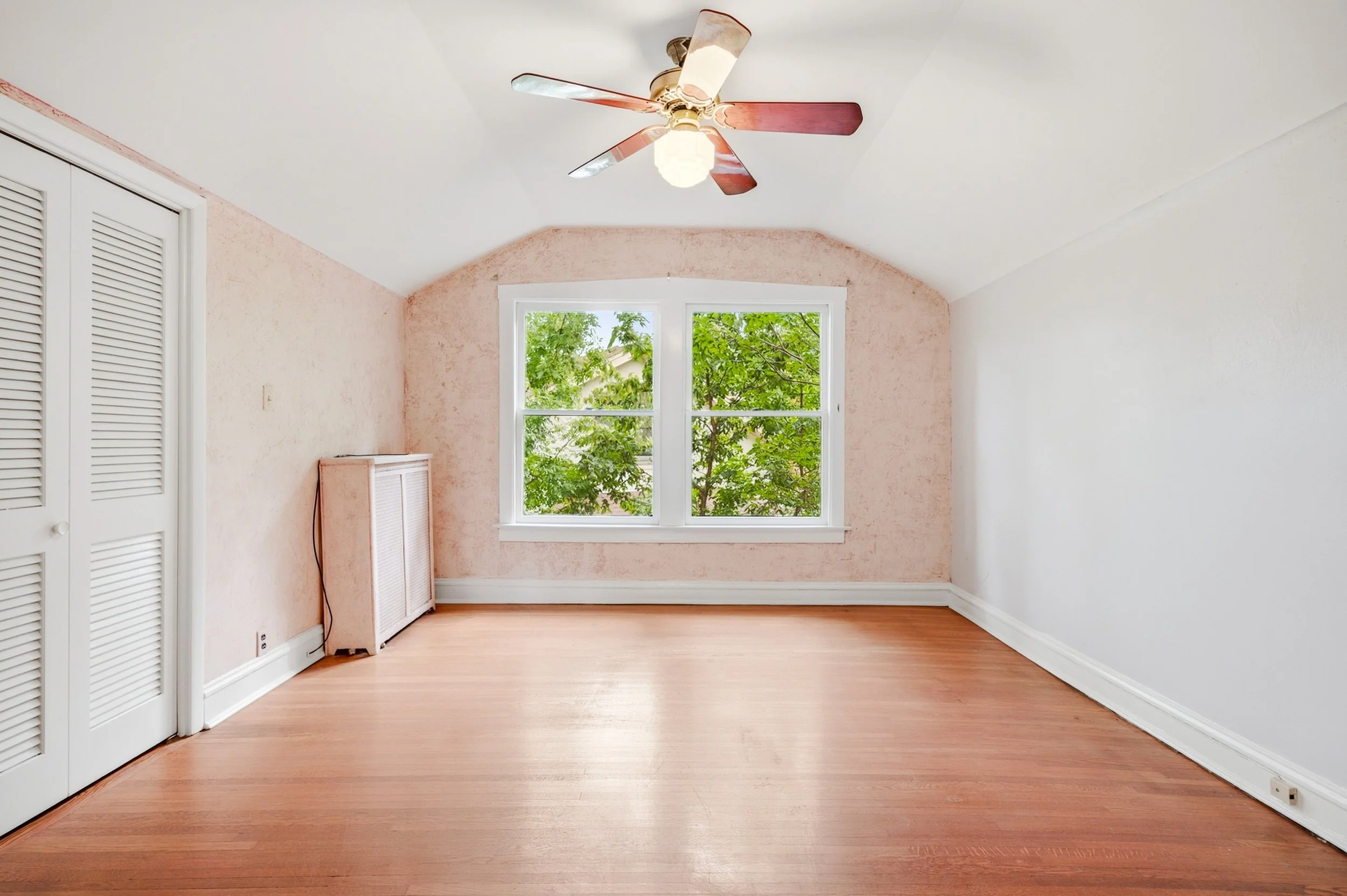 riverside-second-floor-bedroom-barrel-vault-original-radiator.jpg