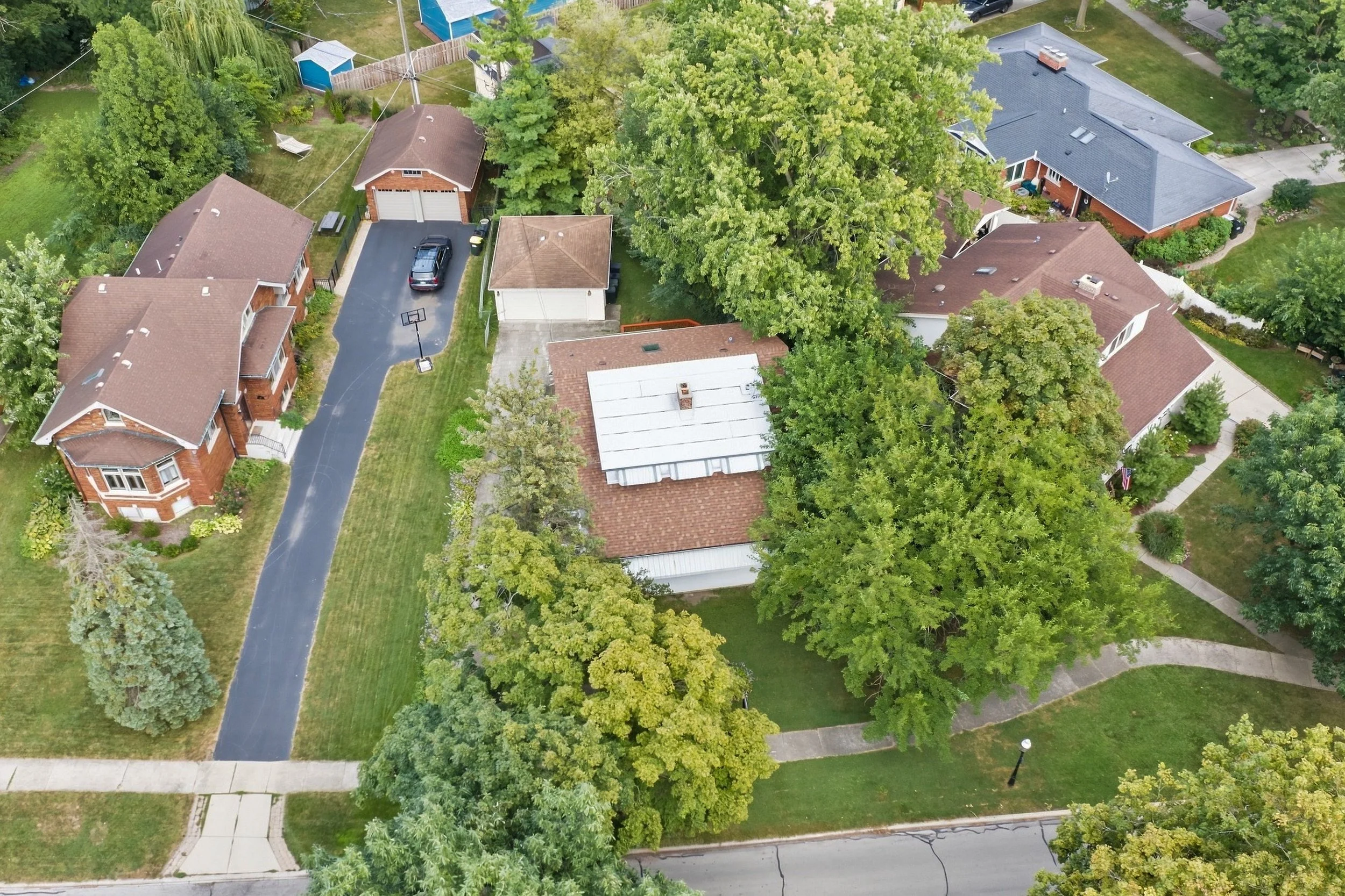 riverside-aerial-view-of-home-on-tree-lined-street.jpg