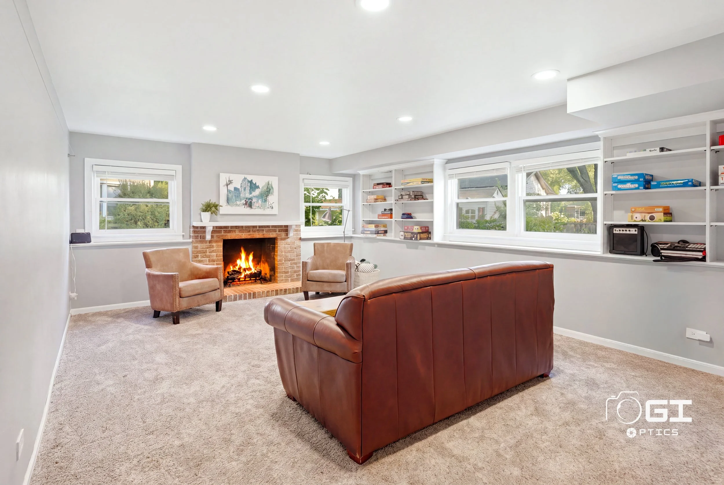 arlington-heights-living-room-lit-brick-fireplace-built-in-shelving.jpg