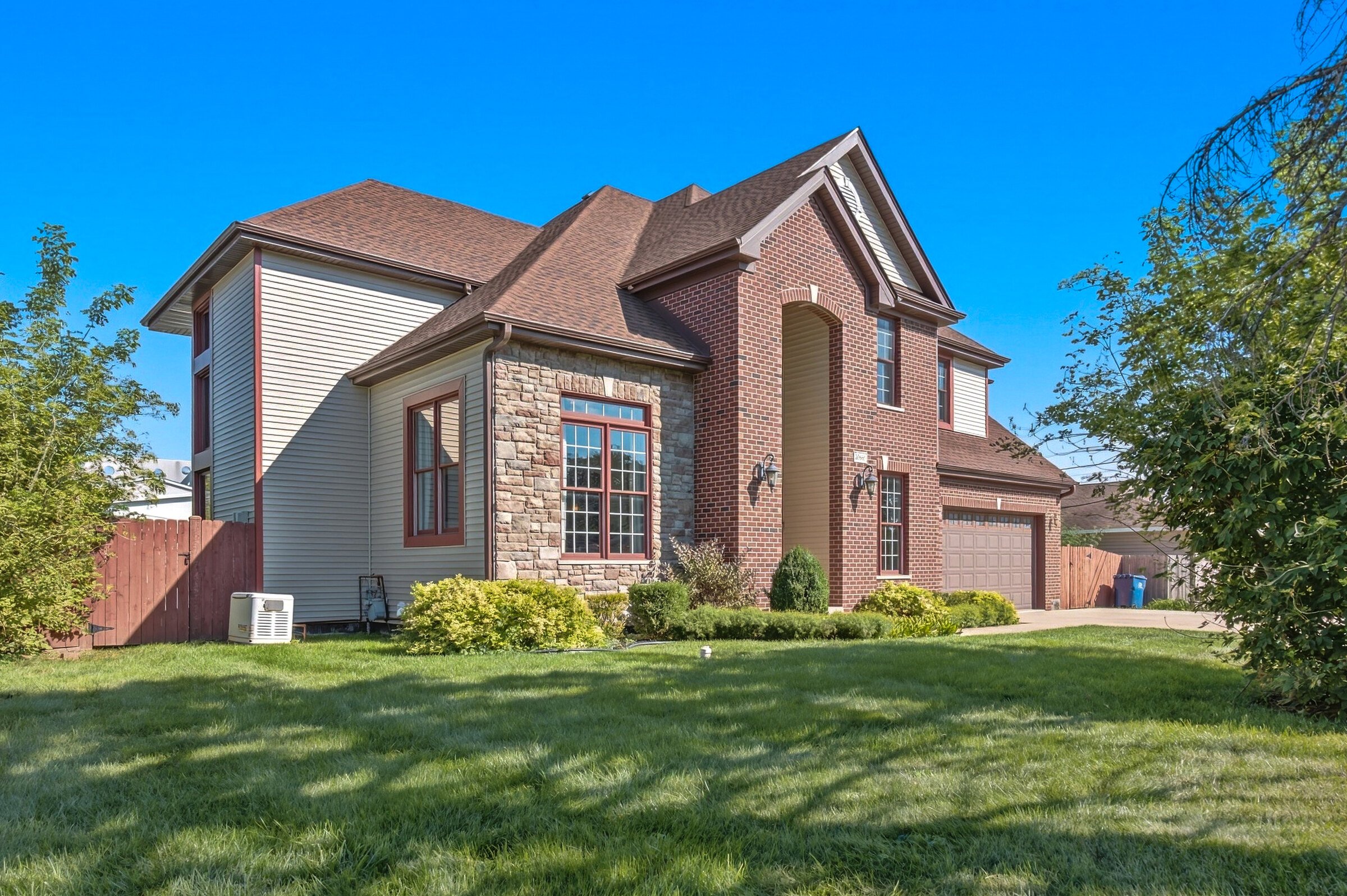 lincolnshire-brick-and-stone-two-story-front-exterior-framing-trees.jpg
