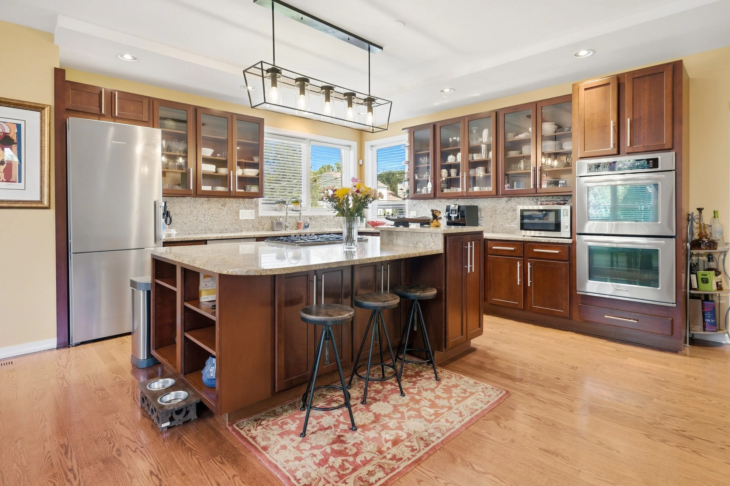 lincolnshire-kitchen-cherry-cabinets-granite-island-double-wall-ovens.jpg