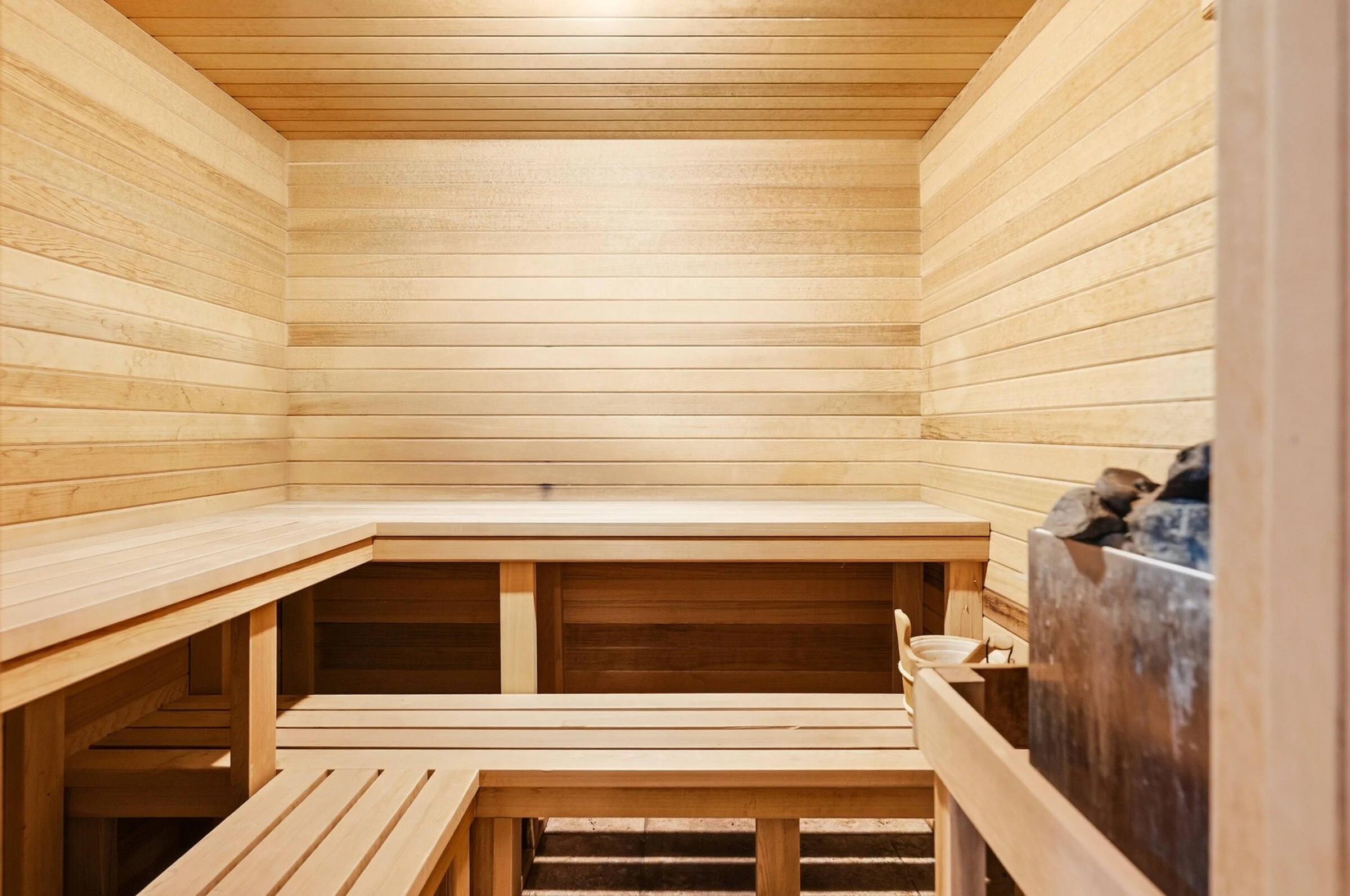 lincolnshire-cedar-sauna-tiered-benches-and-stone-heater.jpg