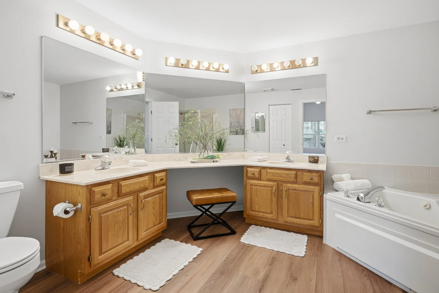 Primary bathroom with a jacuzzi tub and a dual vanity.jpg