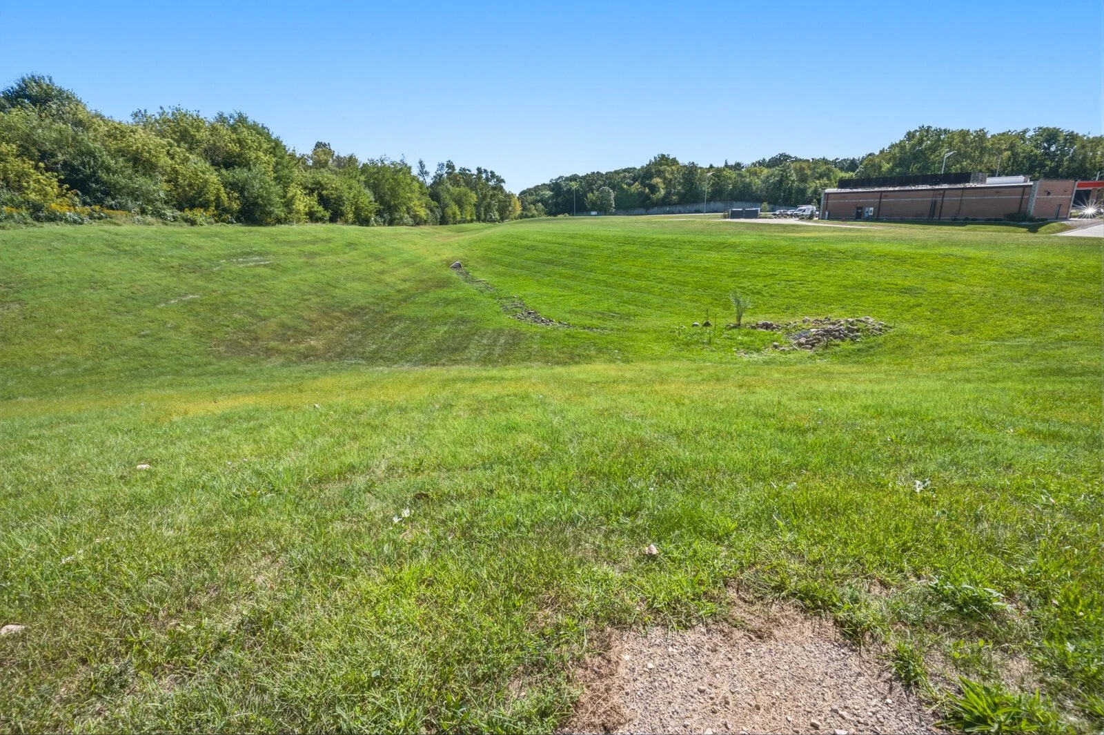 Detention basin with a graded side slope on the Sands Landing commercial site.jpg