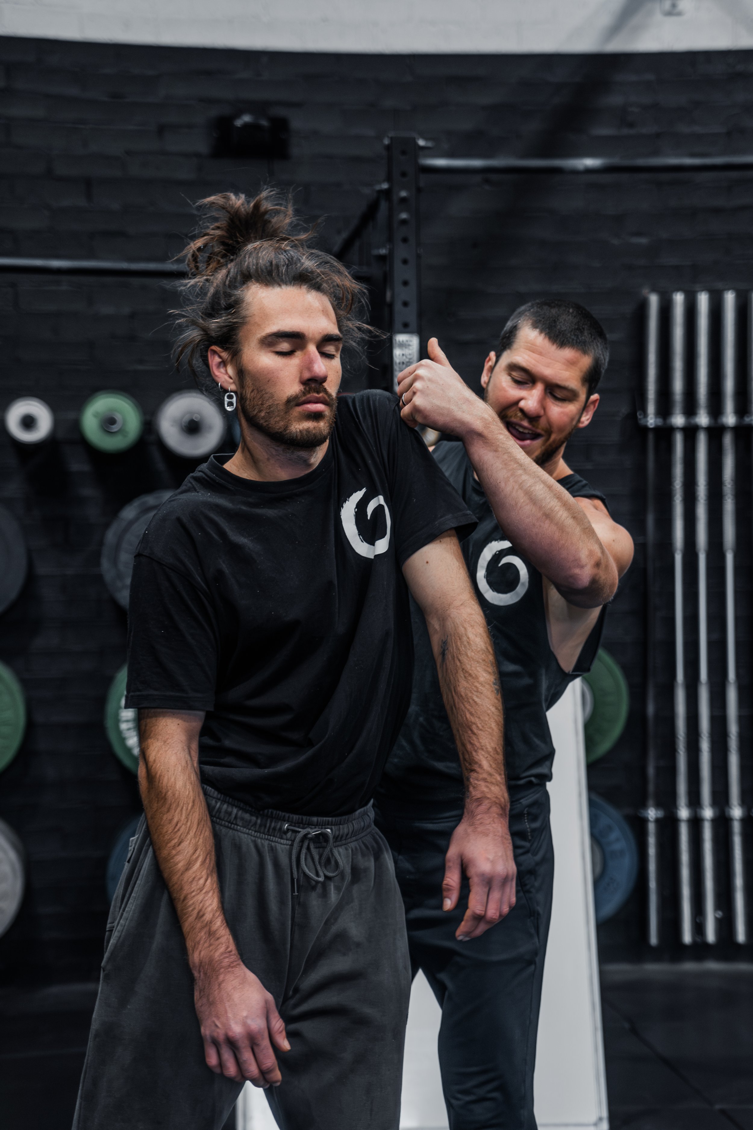 Personal coaching session supporting shoulder mobility and functional movement.