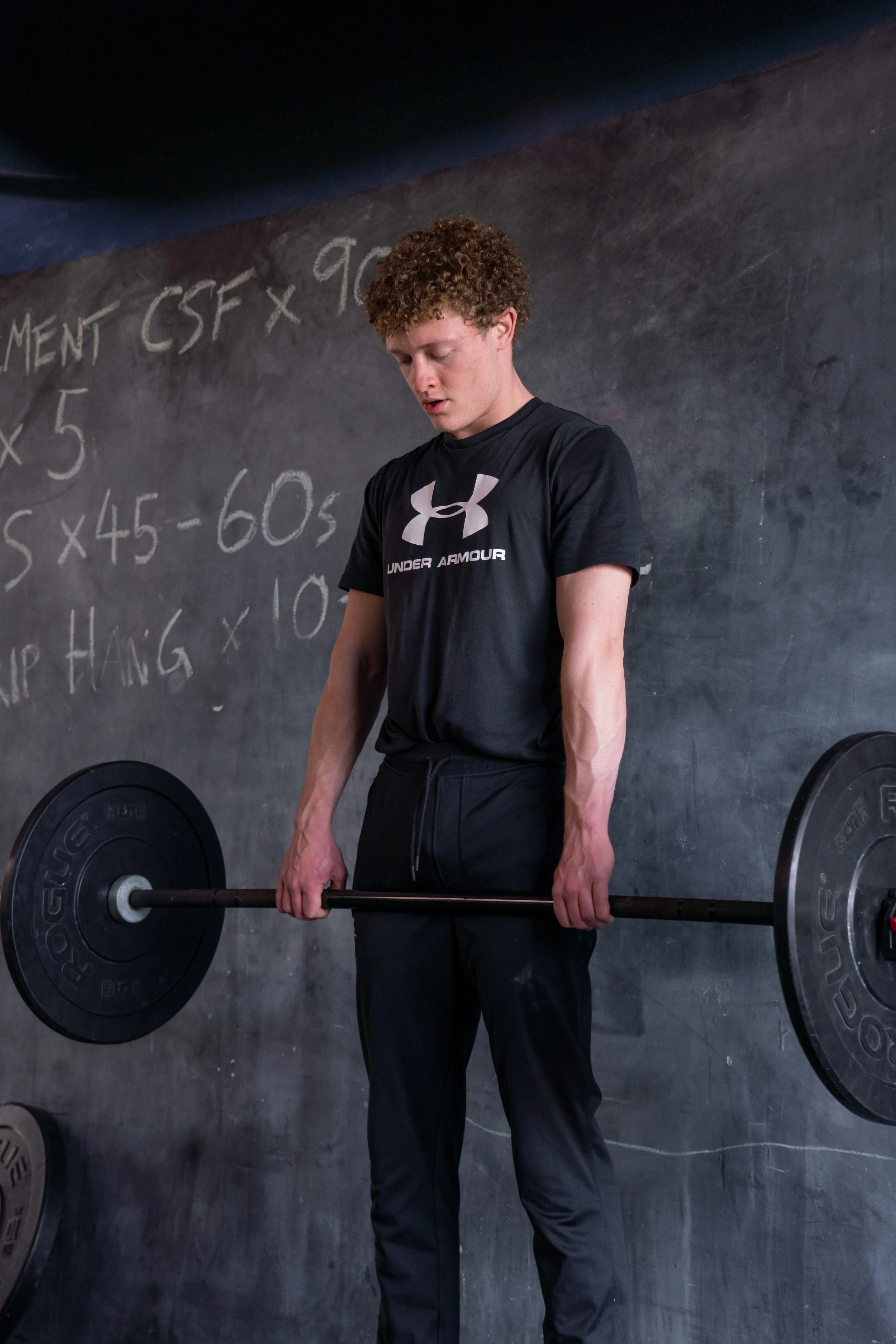 Barbell strength training focusing on foundational movement patterns.