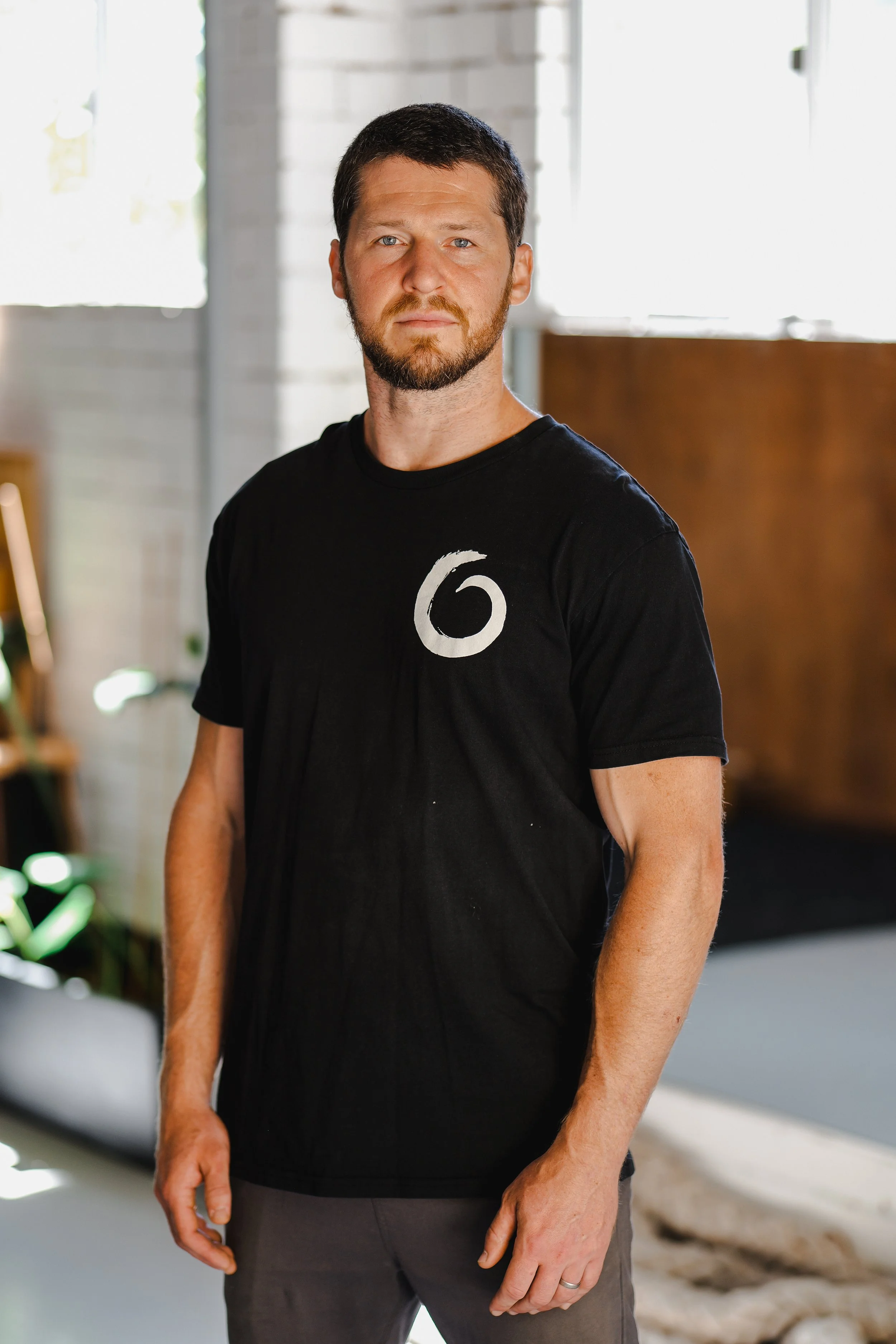 Portrait of Meditative Monkey movement coach in a studio setting.