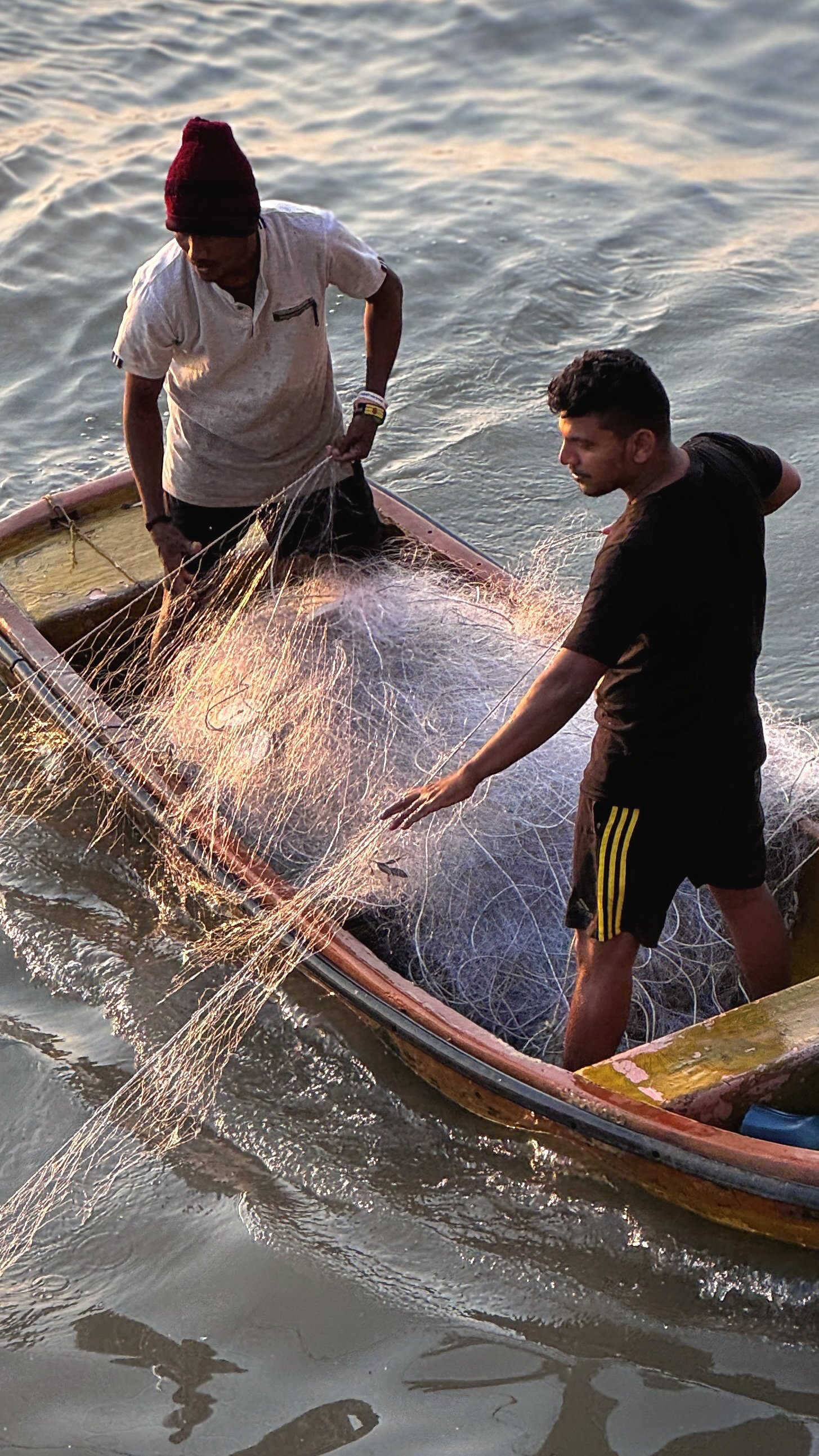  watching the fishermen haul in the day’s catch 