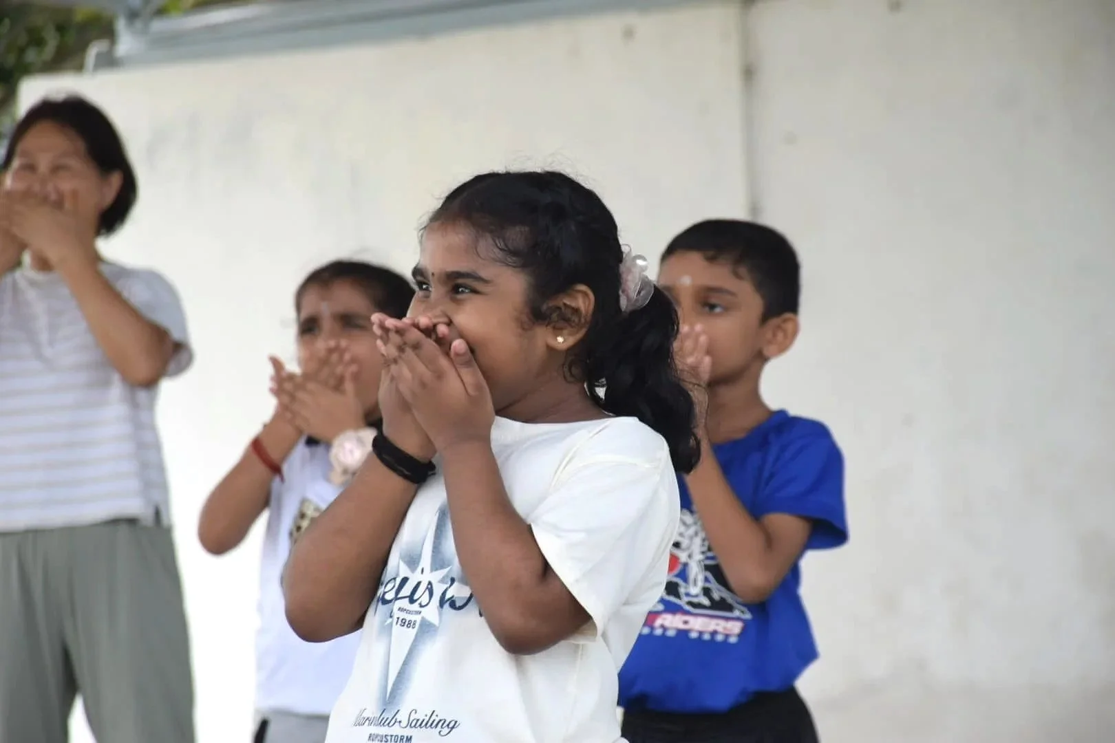 Children dancing during an outdoor Mandarin class in Banting, Selangor