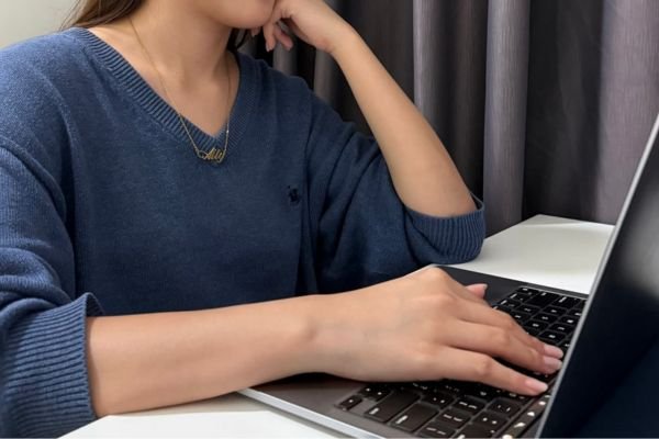 Female student using a laptop to learn Mandarin online