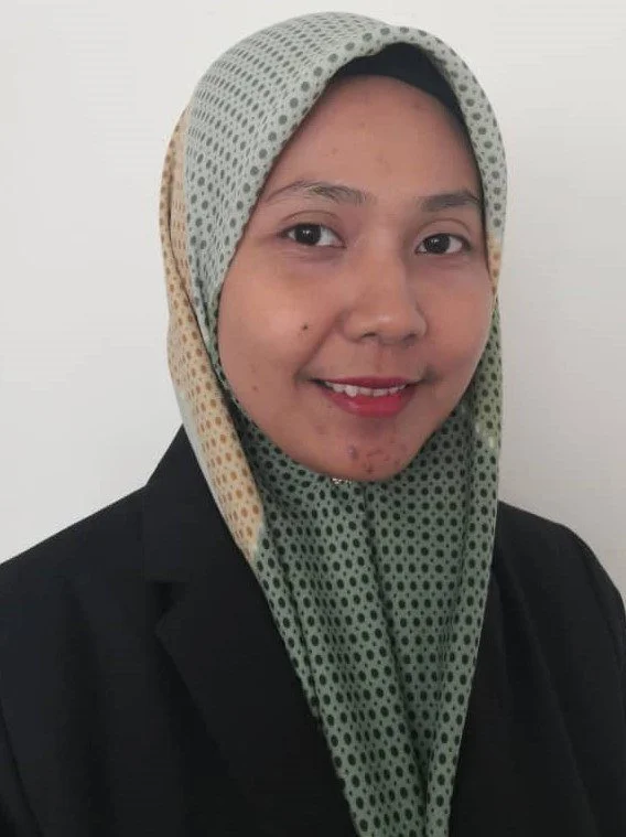 A happy female Malaysian student smiling after her online Mandarin class
