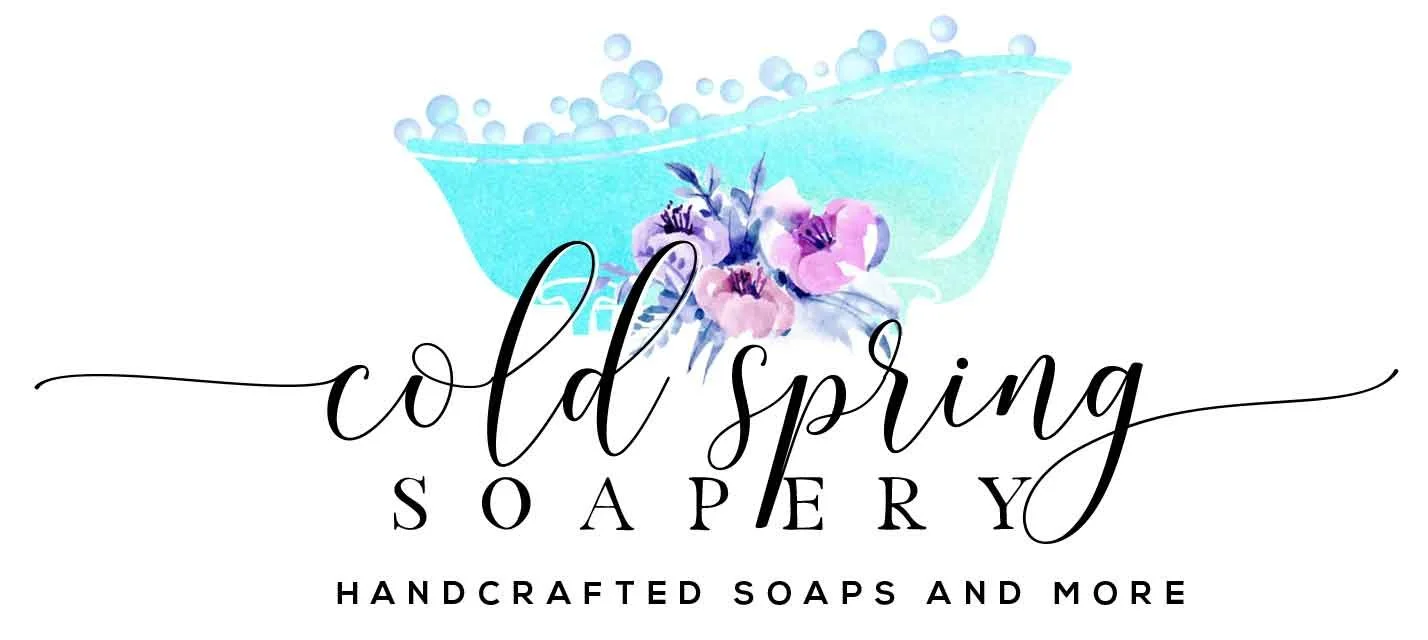 Logo for Cold Spring Soapery with a blue soap bubble and pink and purple flowers, with the text 'Cold Spring Soapery' and 'Handcrafted soaps and more'.