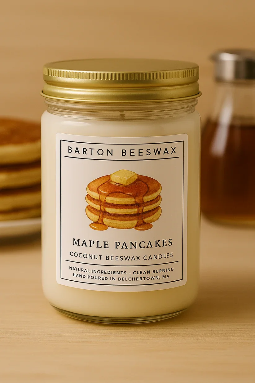 A jar of Barton Beeswax Maple Pancakes Coconut Beeswax Candles with a white label showing a stack of pancakes with syrup and butter.