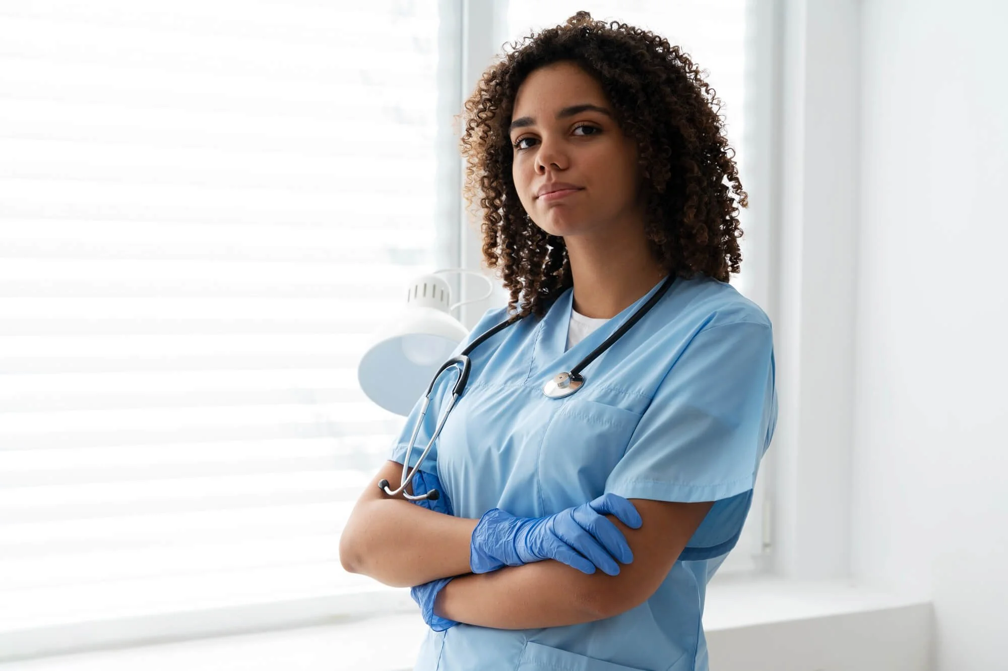 Healthcare worker in blue scrubs