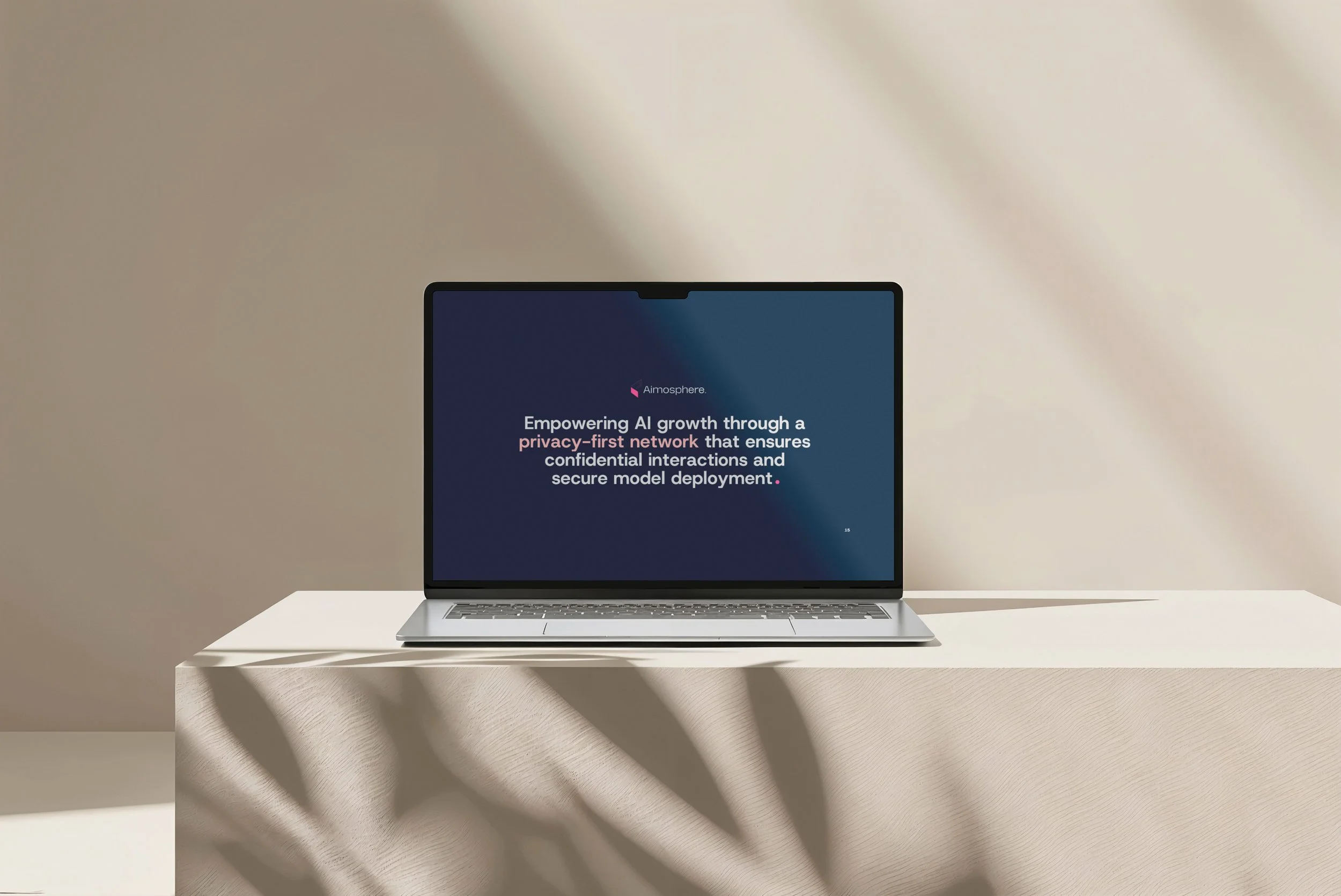 A laptop on a white surface with a presentation slide displaying the text "Empowering AI growth through a privacy-first network that ensures confidential interactions and secure model deployment."