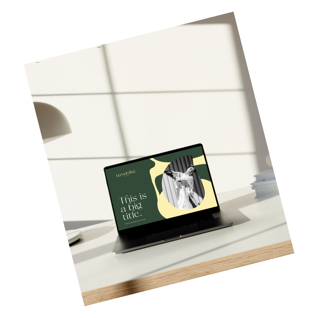 A tablet on a desk displaying a design with the text "This is a big title" and an image of a woman singing with her arm raised, surrounded by abstract green and yellow shapes.