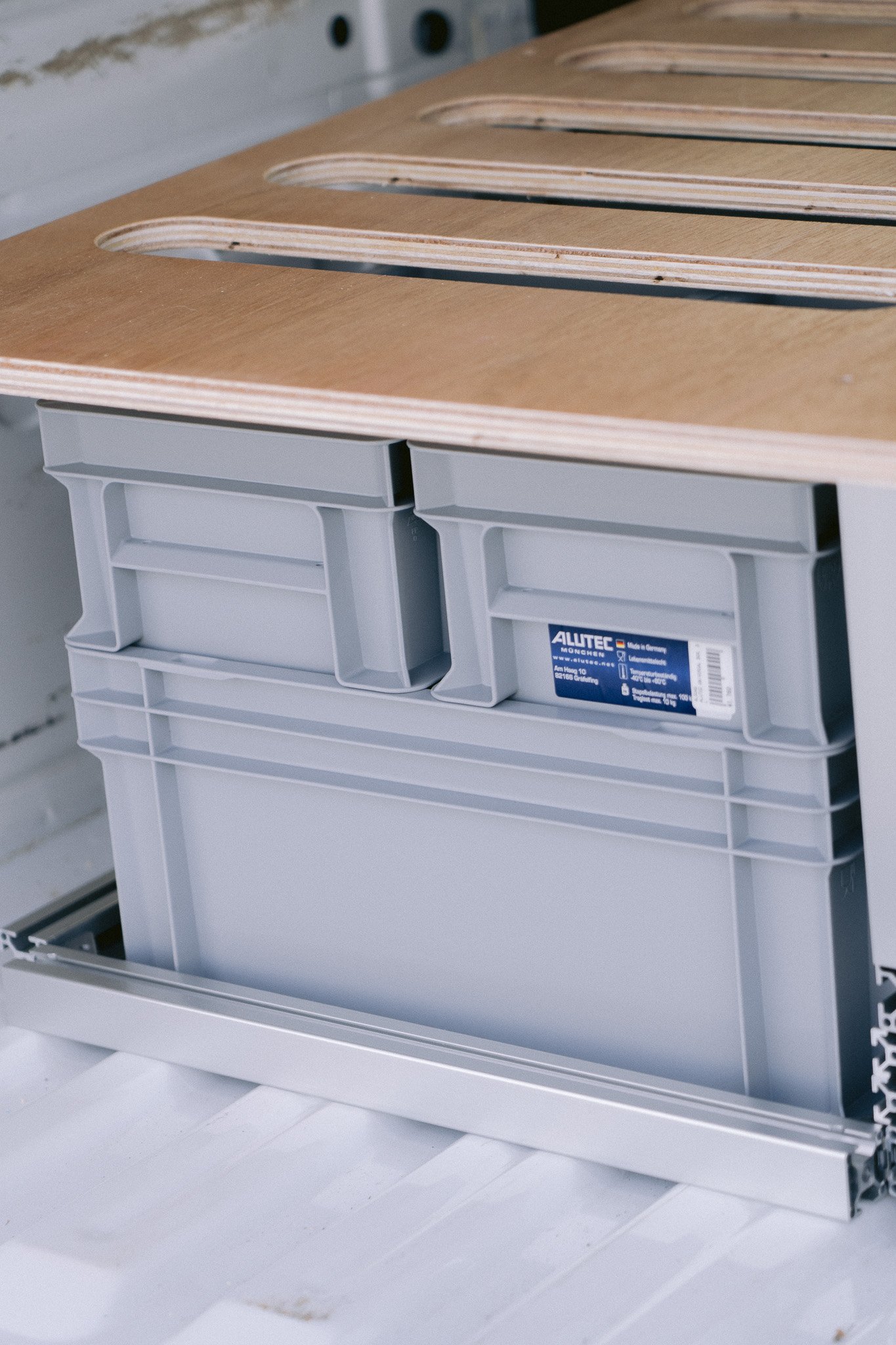 Campervan rental in Tokyo with under-bed storage and wooden bed platform