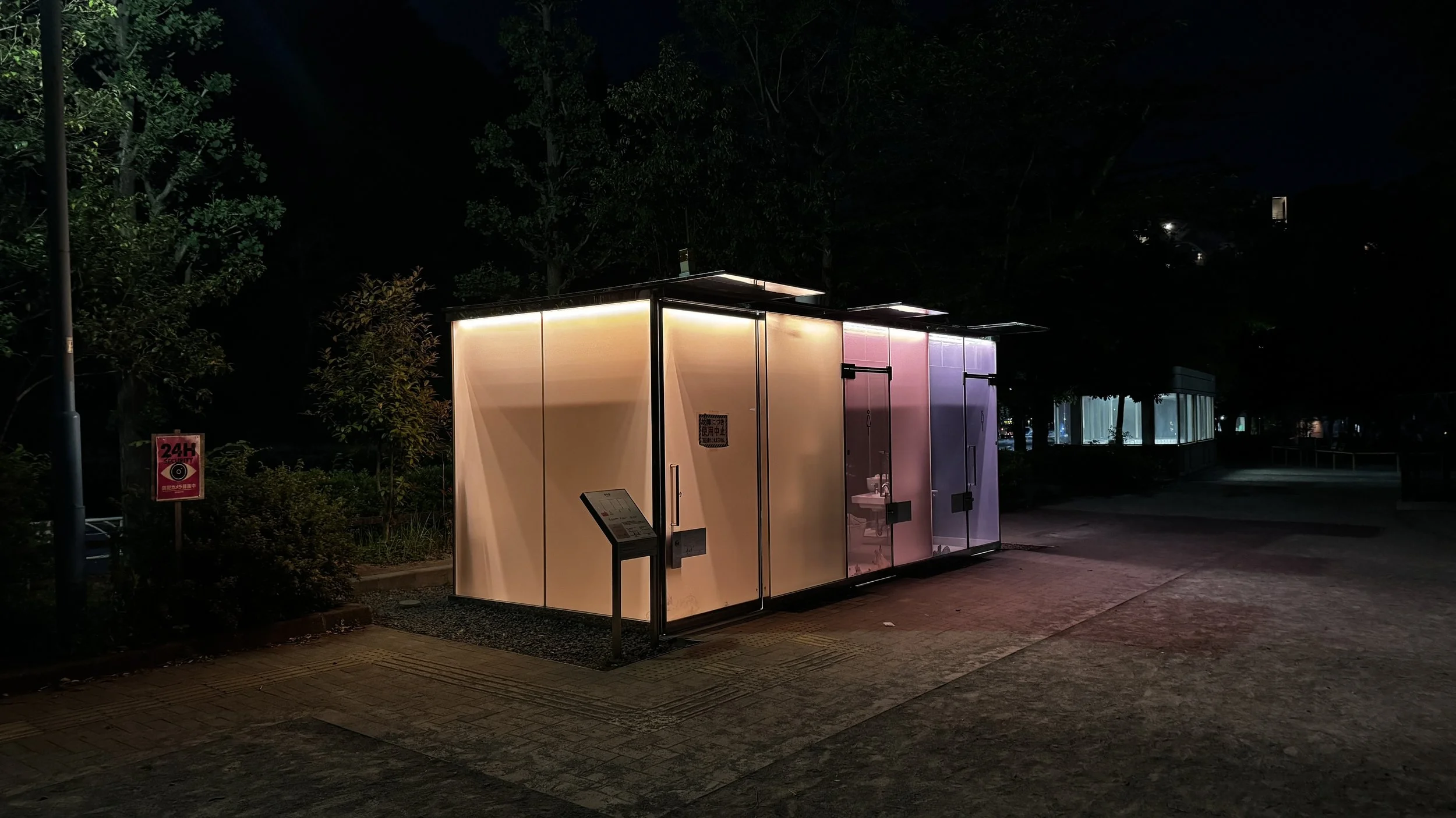 The Tokyo Toilet illuminated designer public restroom in Shibuya at night