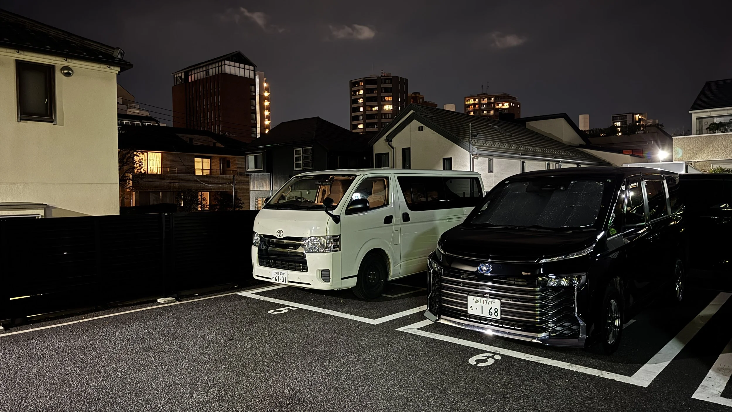 Motion Campervan parked in quiet Tokyo residential neighborhood at night