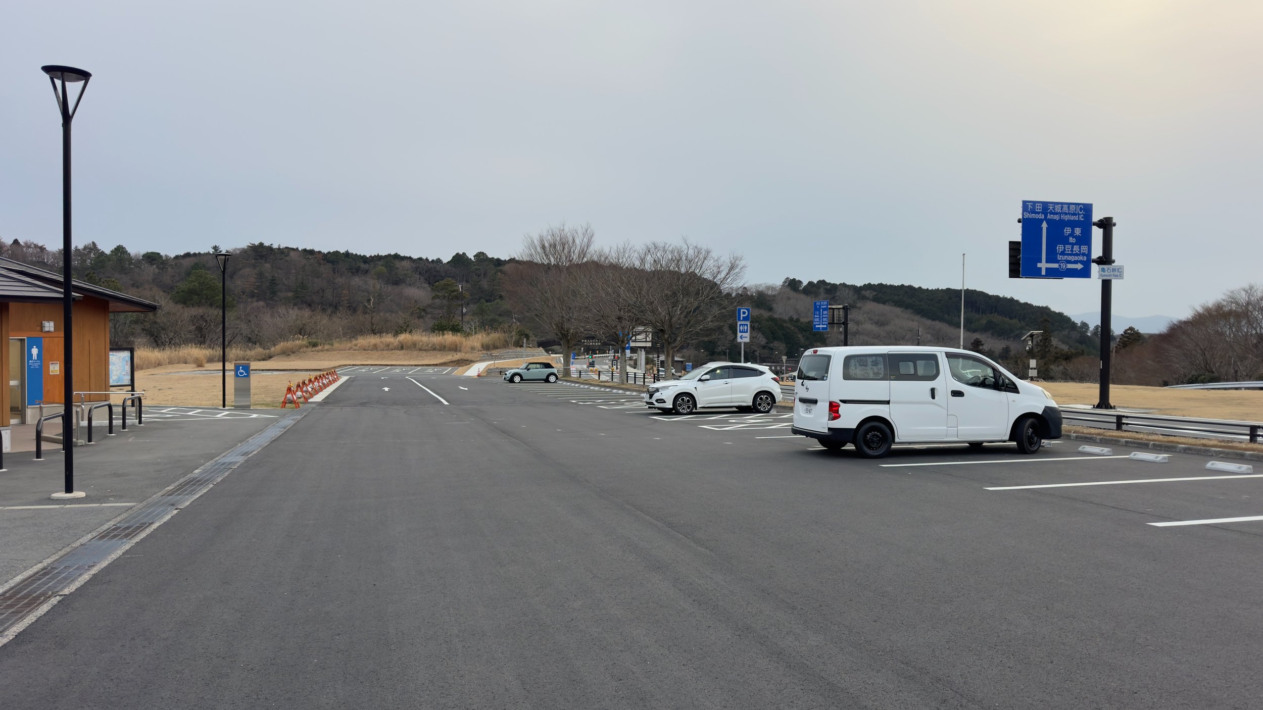 Campervan parked overnight at a michi-no-eki roadside station in Izu, Japan