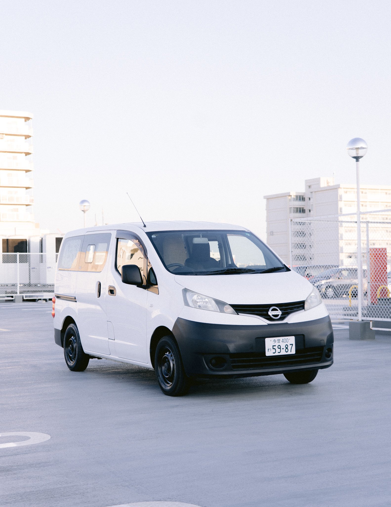 MOTION Campervans NV200 M2 campervan parked in Tokyo