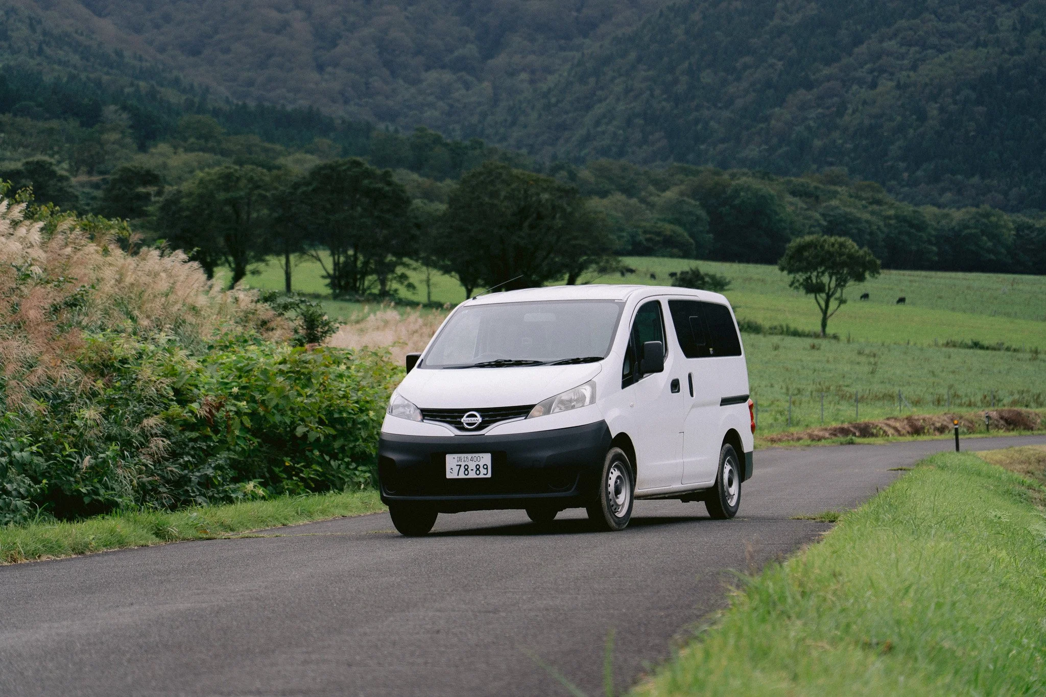 M4 Nissan NV200 campervan with slide-out bed
